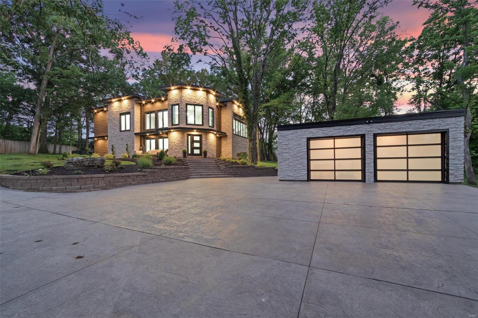 A Kirkwood masterpiece! Completely remodeled 4 bed, 3.5 bath home in the beautiful Sugar Creek area on over an acre of park-like setting. A 2-story entrance hall and open staircase greets you. The kitchen features quartz counter tops, custom cabinets, a professional grade fridge and gas oven/range, stainless farmhouse sink, and more. The kitchen opens to the dining area and main living area. The living room boasts vaulted ceiling, skylights, a stone gas fireplace, and a wall of doors that can open to the outdoor living area. The large patio has a stone fireplace, stone serving area with built-in fridge and gas grill. The main-level master suite has custom closets, large windows, electric fireplace. The master bath is a work of art with a separate room with double showers and soaking tub, double sinks, amazing tile work, more. The upper level has a spacious family room with fireplace. 2 bedrooms with built-in bunk beds, full guest bath, bedroom suite, office, more.
