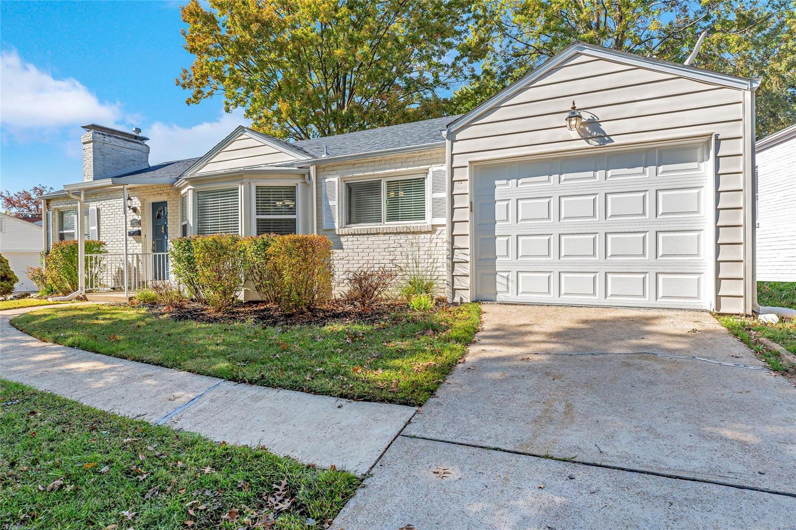 Cute refreshed large 2-bedroom 1-bath home in Webster Groves with an oversized 1-car garage. Gleaming hardwood floors; inviting living room with built in bookcase and floor to ceiling painted brick fireplace; spacious dining room with bay window area for even more dinner guests; updated tiled kitchen with white cabinets and granite countertops; 2 ample sized bedrooms that easily could fit king sized beds; clean and neat open basement; bonus sitting room could make a perfect enclosed office with minimal construction or use as it is for a breakfast room or an amazing added space to lounge with easy access to the sprawling backyard or oversized garage. Enjoy the outdoors under the covered back porch or stretch out and play or BBQ in the fenced-in backyard. The home is in the award-winning Webster School District and is close to shopping and restaurants.