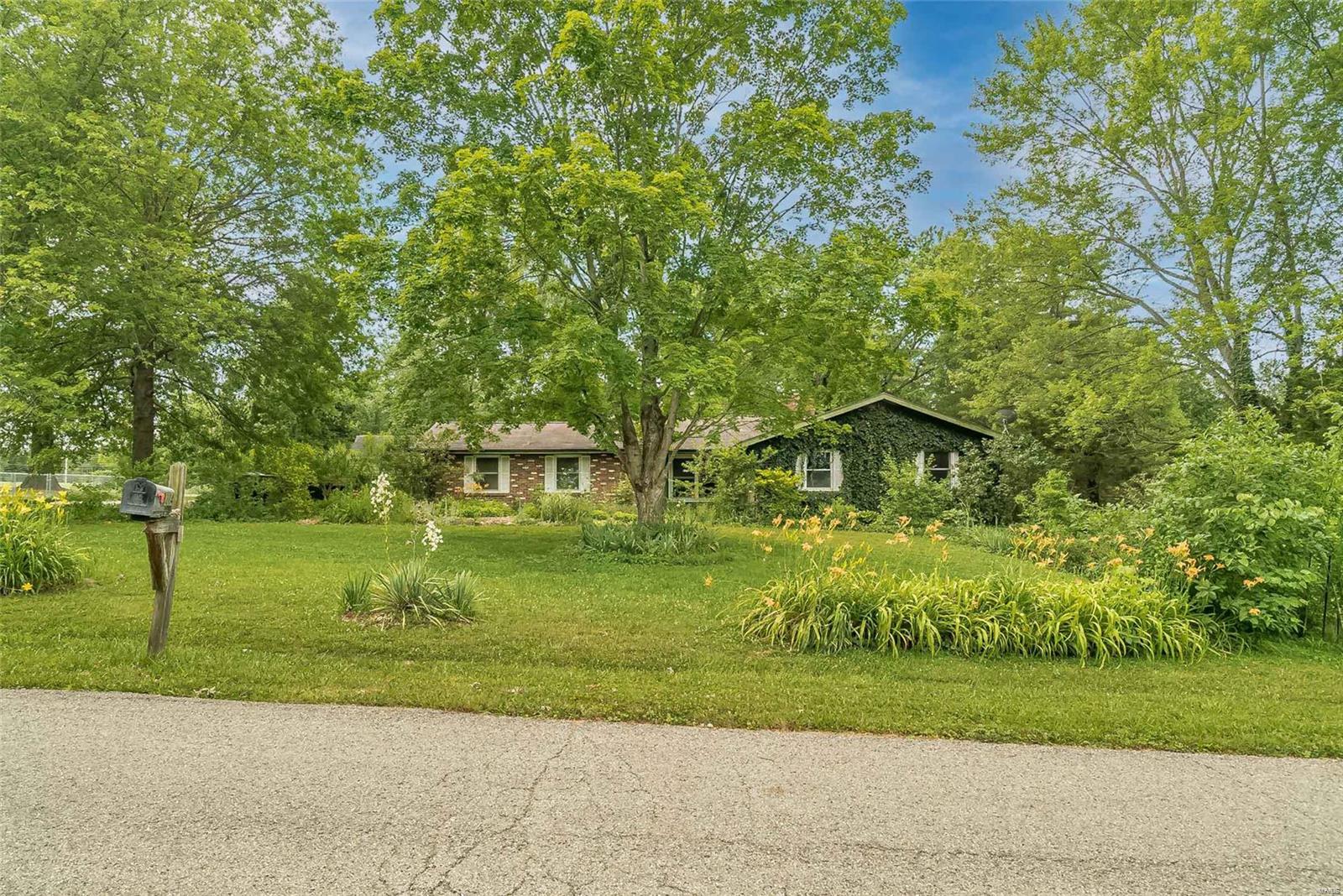Ranch home sits on .55 acre corner lot. 5 bed, 4 bath Ranch home. Bring your ideas, this home has potential. 2 HVAC units. Triple pane windows installed in 2014. New covered deck 2020. 2 full kitchens, basement kitchen has dishwasher electric stove/oven. 2 car garage with side entry. Seller was a avid gardener and loved to spend time in the yard with the many flowers and fruit trees. Home is being sold As-is condition. Seller to do no repairs or inspections.
