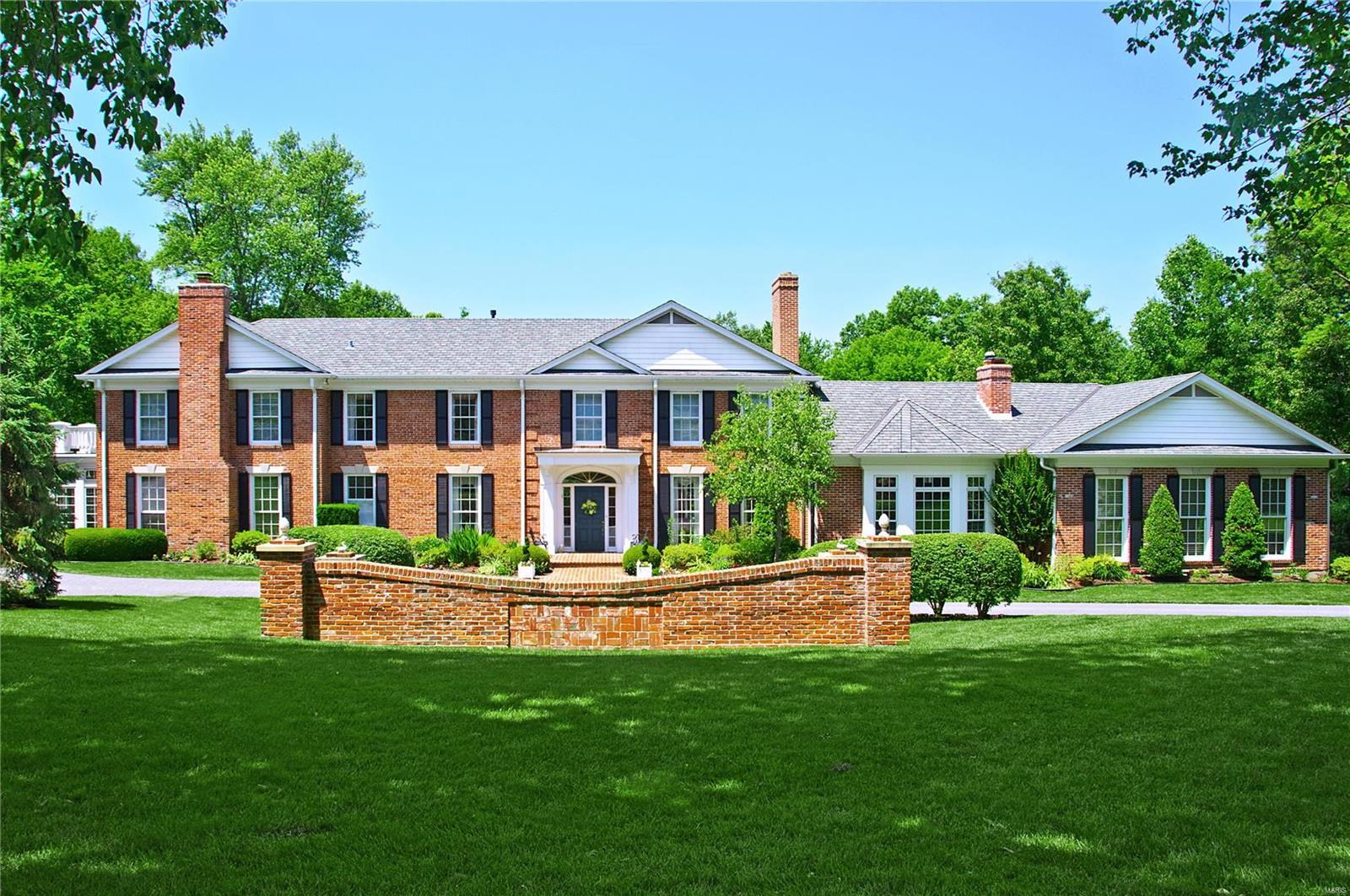 Exceptionally handsome home ideally located & situated on a breathtaking 1.9 acre lot. From the moment you enter, you are welcomed with dramatic views of sweeping lawn and glorious amenities. Beautiful living room with fireplace & gracious dining rm both w/ pretty bay windows looking out on the gorgeous setting w/ pool & gardens. Cozy den/library, with rich wood cabinetry, is adjacent to the well-appointed main flr master ste & solarium, and serves as a quiet retreat w/ fireplace & wet bar. The perfect heart of the home is the huge kitchen area which incl a separate entertaining kit for easy pool access, & has a peninsula w/ extra cabinetry, bar sink, & breakfast bar serving the open family rm w/ fireplace and lg breakfst area w/ 3 sides of windows. Upstairs find 4 additional BRs, a bonus rm which cld be BR & 3 full baths. Other impt features include: main flr laundry, front & back stairs, 2 fin LLs, 32x16 heated pool, pool house & side entry 3 bay garage. Additional Rooms: Sun Room