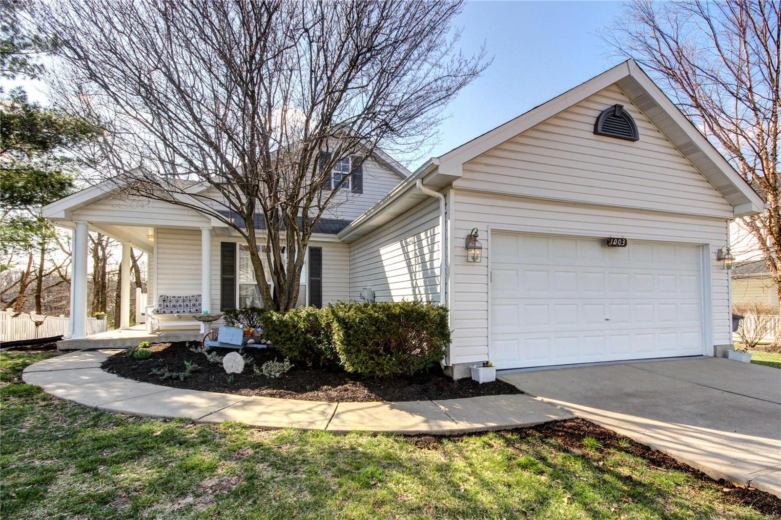 Don't miss out on this updated ranch home in Wentzville! You'll immediately notice the curb appeal with a pathway that leads past a beautiful garden and a wraparound porch welcoming you. Enter to the open layout of the eat-in kitchen and living room. The kitchen boasts a breakfast bar, tons of cabinet space, wood floors, and vaulted ceilings! You'll have even more natural light in the living room with a bay window and skylights, plus convenient built-in shelving. The master suite is a retreat with vaulted ceilings, a walk-in closet, and full bathroom. Two more spacious bedrooms and another full bath complete the space. The lower level is clean and ready for your finishing touches! Enjoy the warmer weather on the maintenance-free composite deck that overlooks the backyard and trees.  Just moments from schools, shopping, highways, and restaurants, this home is just waiting for its new owners!