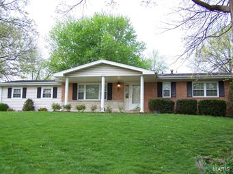 This is your opportunity to own a spacious well-cared for ranch home on a large lot in a great location! The exterior of this home is brick with some vinyl, covered soffits and fascia offer less maintenance. The large front porch is covered and showcases brick and stone. This home offers 3 Bedrooms on the main level, divided Bedroom Floor-Plan. Two of the Bedrooms have full baths. Also on the main level is a full Living Room, separate Dining Room, Eat-In Kitchen and Family Room. The Family Room is off-set with an additional Bedroom w/Bathroom, Washer & Dryer Hook-Ups for main floor convenience. This space is perfect for an In-Laws quarters or other possible needs. The lower level is partially finished with Bedroom, Bath with huge walk-in tiled shower and recreational area. The rear entry 2-Car over-sized garage offers privacy and function. Quick access to Hwy 70, Bryan Rd / 364-Page Ext. and the conveniences that O'Fallon offers. Call today before the sale sign reads, "Under Contract"! Some Accessible Features