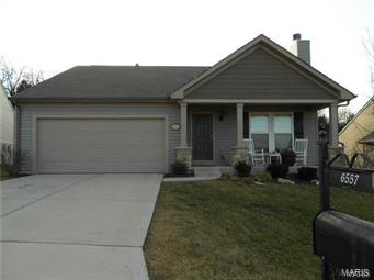 Gorgeous 4 bedroom home in Castle Heights Subdivision backing to common ground in the Windsor School District.  This home is only 3 years old and features an open concept with main floor laundry and is loaded with upgrades including an awesome front porch, vaulted ceiling in the living, dining room area, wood burning fire place, breakfast bar, kitchen island, Jen Air stainless appliances including a micro/convection oven.  Beautiful new hardwood flooring has just been completed in the living, dining room and hallway, along with new frieze carpet in the main floor bedrooms.  There is also a fresh coat of neutral paint throughout the main floor.  The master bedroom has a ceiling fan and it's own private bath.  An open staircase leads to a large basement that has a full bath rough in and sump pump.  Castle Heights offers approx 40 acres of common ground with breathtaking views and wildlife.  Conveniently located close to highway 55, schools and shopping.
