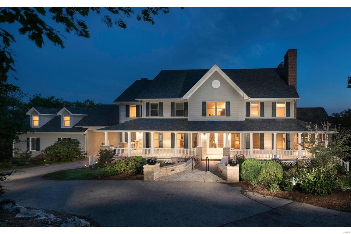 Breathtaking views make this 3.5 acre retreat feel like a European getaway! The inviting wrap around front porch, graceful entryway bring you into a light filled versatile 2 story floor plan! Wood flooring, custom mill work & built ins, detailed finishes, a chefs kitchen connecting to breakfast/hearth room and the dining room, all bedrooms offer a private bath, 7 fireplaces thru-out. Each room has a special ambiance, not your typical 2 story! Oversized, finished 3 car rear entry w/ huge turnaround/additional parking and private entrance to suite above. Large screened porch on the main level offers stunning views. Vaulted master suite w/ sitting room, private deck area, and customized walk in closet and a 2nd floor laundry add to the well planned layout. Deep pour in walkout LL also offers a wine storage room and plenty of area for future finish. New roof, zoned HVAC... Pool and hot tub "as is" were professionally closed in 2017 and not opened in 2018.