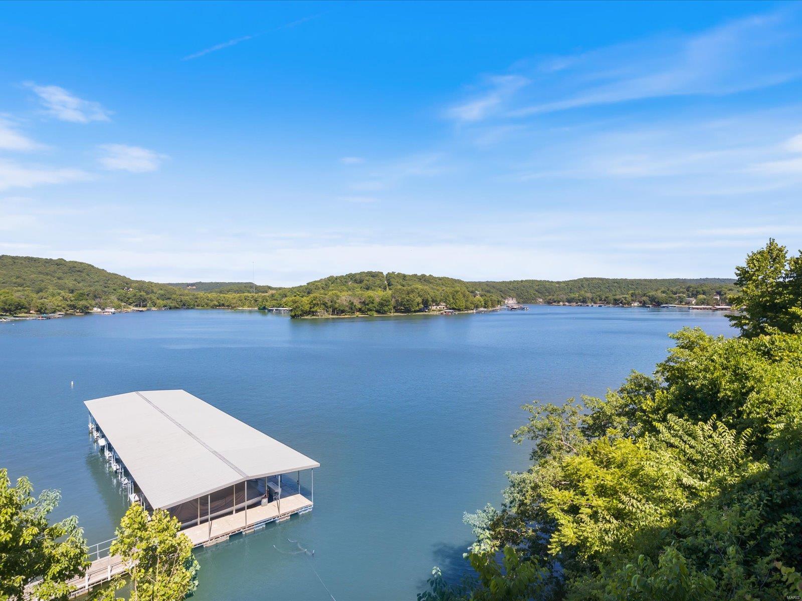 Big summer plans on a small budget? Look no further than this affordable condo in the heart of Lake of the Ozarks!! This prestigiously maintained condo is sure to catch your eye from the door but if its wide open living space doesn't sell you, it's views sure will!! Enjoy summer days fishing from your dock, swimming in the pool, and boating on the Big Niangua. And let's not forget those beautiful summer nights relaxing on your balcony!! This condo comes fully furnished and includes TWO boat slips, TWO dock lockers, and TWO boat lifts. A short drive to Camdenton, and an even shorter drive to the golf courses and Old Kinderhook for endless opportunities to explore the lake at it's finest! --Come down in the winter to enjoy Old Kinderhook's ice rink, just minutes away!-- The waters calling your name, so call me and we'll have you enjoying lake life in your very own condo!! Location: End Unit