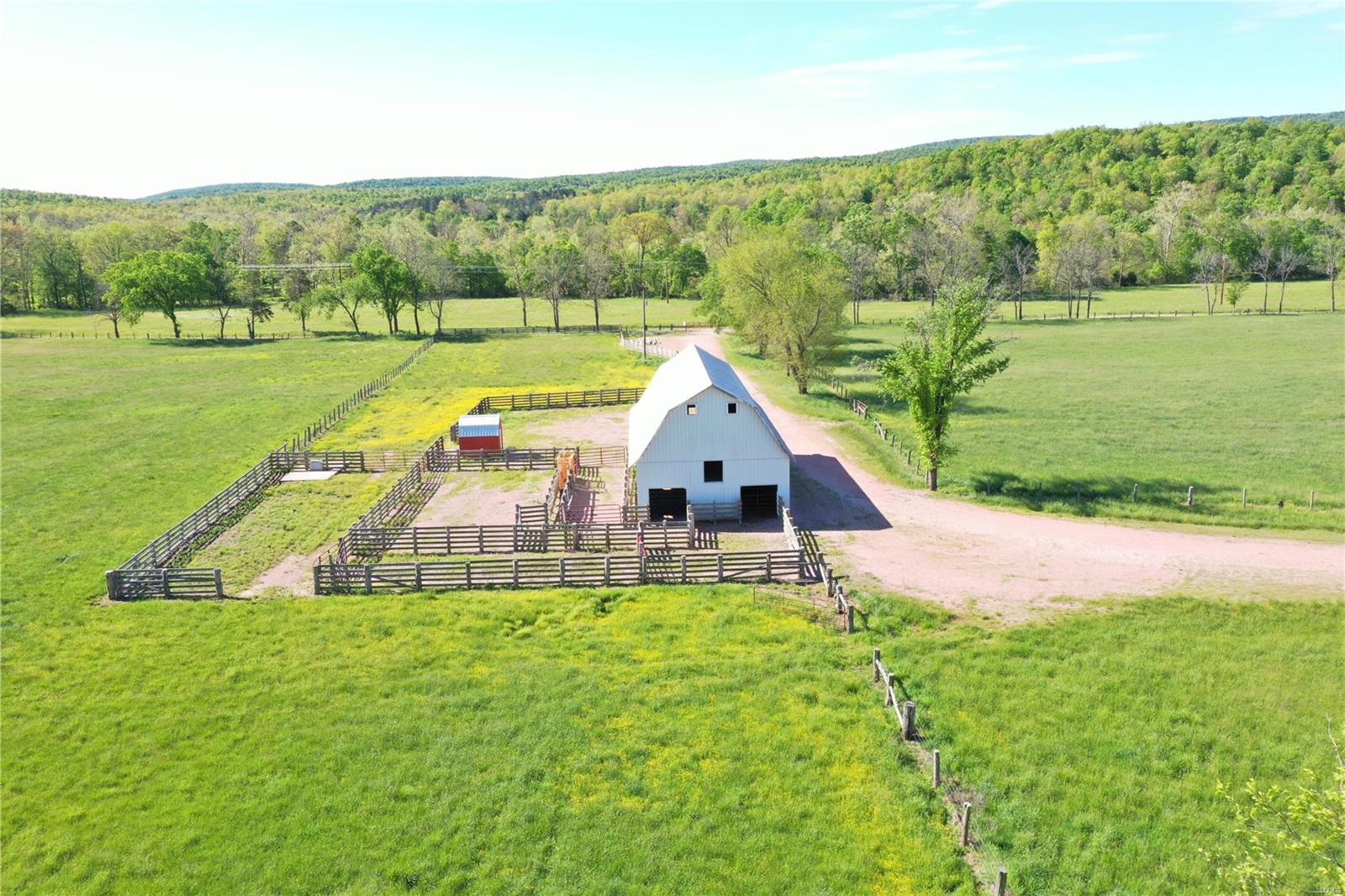 Top notch cattle farm with income producing quarry lease. 235+/- acres with 140 in good grass, fenced, cross fenced and well watered. Barn, good set of working pens, well and electric are on site. Also, a pond and year round Cedar Bottom Creek runs through the property. With nearly a mile of county road frontage, and multiple good home sites, this is a well rounded farm in top notch condition that would be a great addition for the commercial producer or make a terrific homestead. Additional land available.