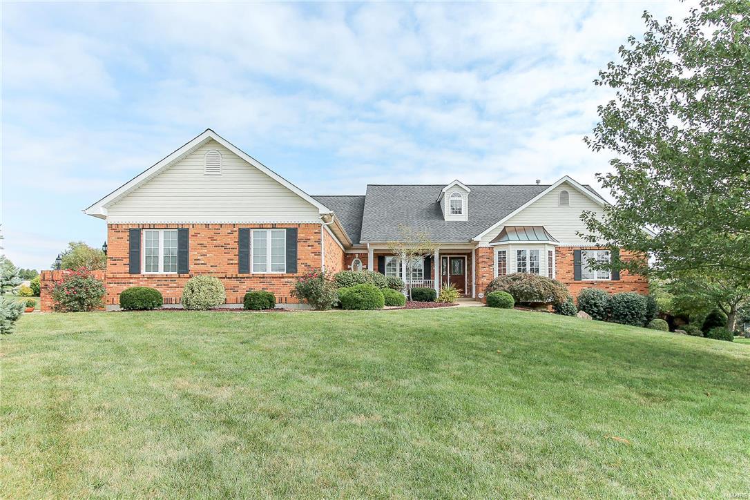 Welcome to Camelot! Come see this fabulous ranch on a 1 acre lot in prestigious Camelot subdivision. The inviting open floor plan boasts a great rm with vaulted, beamed ceiling and fireplace; formal dining rm; living rm/study; spacious master BR suite; two additional bdrms; laundry rm; and spacious kitchen. The spectacular kitchen has 42” cherry cabinets, granite countertops, SS appliances, breakfast bar, and center island. Hardwood floors throughout much of the main floor. 9’ ceilings throughout. Large covered cedar deck in the back to enjoy your morning coffee and evening wine overlooking the parklike yard. Side-entry 3-car garage. Brick front with wing walls.  Inground sprinkler system. This home also has new top of the line HVAC, water heater and upgrades throughout! 372 Galahad is located in a highly sought after neighborhood among trees and woods with walking trails, lakes, and nearby city park. Elementary and middle school minutes away! Just 10 minutes from Chesterfield Valley! COOL: 14 SEER+