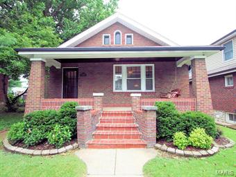 Located on a tree lined street in the heart of desirable South Hampton sits this outstanding brick bungalow with extensive updates. Walking up you'll be greeted by a long covered porch with a charming bench swing. Gorgeous stained glass windows adorn the entry foyer & living room. A fully functional gas fireplace assures no more chilly nights! Stunning hardwood flooring sprawls throughout the main floor and ties in with the 2-tone stained wood trim & doors found on most of the main floor. Professionally remodeled gourmet kitchen has granite center island & counter with under mount sink complements stainless steel dishwasher,  gas range, microwave, lighting and tons of storage in the custom cabinets and pantry. Entertain your guests on the spacious back deck, patio, newer 6' fence and 2 car brick garage. Two spacious bedrooms share a charming black and white tiled bath with pedestal sink and linen closet. Enjoy the extra space in the walkout lower level rec room and remodeled full bath.