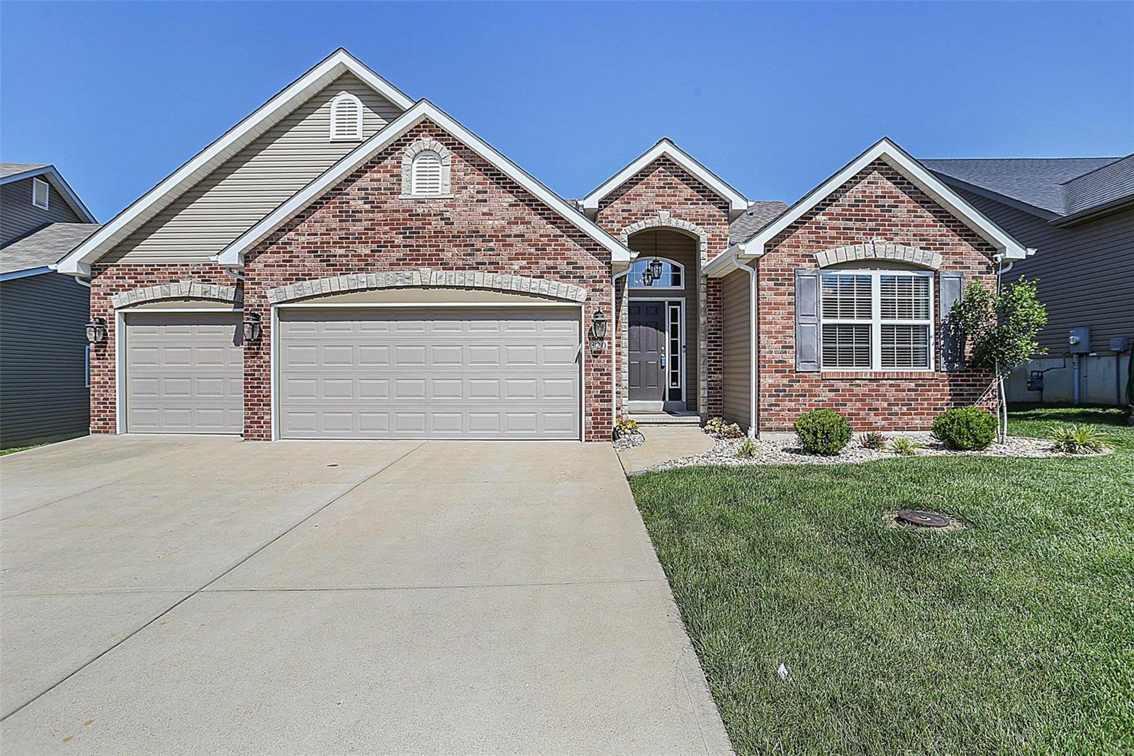 Stunning open floor plan on nearly 1/4 acre! The heart of this home is the kitchen featuring granite countertops framed by espresso cabinetry & stainless appliances. The luxury laminate flooring provides a modern touch & the abundant windows allow sunshine! The fireplace anchors the great room & built-ins create an inviting atmosphere. Through the dining area French doors, step onto an amazing, covered maintenance free deck! What a wonderful spot to enjoy summer cocktails or morning coffee! The primary suite has a tray ceiling, walk in closet, bay window & luxury bath with garden tub, separate shower & double sink vanity. Convenient main floor laundry. The spindled staircase takes you to the lower level with 4th bedroom & 3rd full bath. The remainder is ready for finishing & walks out onto a large patio area for even more outdoor living space! The neighborhood is a dream offering a large community pool with a shaded outdoor seating area and tons of community events throughout the year!