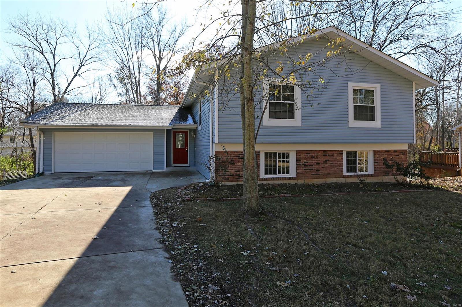 Incredibly rehabbed 4 bedroom, 2 .5 bath home! Everything has been done!   New Carpet, new flooring, some new doors.  Updated baths, and kitchen with granite - all appliances stay.  All new light fixtures, ceiling fans, baseboards.   Newly created laundry/craft room.  Oversized 2 car garage has work shop area, shelving.  Just off the dining room is the phenomenally spacious 2 tier cedar newly stained deck!  Back yard is park like and so close to Laurel Park and walking trails! Newly updated family room in lower level bringing both levels 2000+ sq. ft. Master suites on both levels.  You will be thrilled at all this home offers!