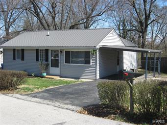 *Multiple Offers* Updated: Metal Roof, Bathrooms, 6 Panel Doors, Interior Paint, Oak Cabinets with Adjustable Shelves, Counter Top, Sink, Microwave, Laminate Flooring in LR and Hall, Carpets in Bedrooms, Ceramic Tile in Kitchen, Breakfast Room, Bathrooms. 15x10 Deck with Steps down to the Big Backyard with Storage Shed on Concrete Pad.  Open Floor Plan, Nice Backyard!