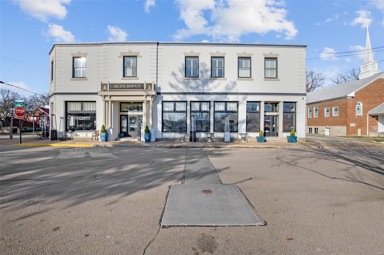 This historic restaurant, bar and hotel- Audubon's, built in 1903, its located in the newly designated, Ste Genevieve National Historic Park. A turnkey opportunity in the center of the downtown business/historic district, enjoy multiple streams of revenue from this high end restaurant, upscale bar, boutique 7 room hotel, basement speakeasy/event area, and newly added outdoor biergarten and music stage area. Oversized paved parking lot and overflow gravel lot is included in price. All equipment/furnishings/inv for entire facility are included. Complete remodel/upgrade in 2014 on main/basement level, hotel, including all rooms, completely remodeled in 2018. Building/roof in great condition. Owners are retiring, currently only open 6 days/wk. Full staffed. Owners will consider transition period. Name/branding assumable. Business can also continue to earn TIF credits. Great business opportunity on a hugely popular tourist path with immediate occupancy and cashflow. Call for private appt. Location: City, Corner Location, Downtown, High Traffic, Other