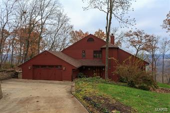 Breathtaking views off this stunning home privately located on a 1.3-acre lot! The back deck faces east, so you will see the sun rise over miles of picture-perfect farmland. Inside, find 5 bedrooms, 3.5 baths & three levels of well-appointed living space. The great room features a stone fireplace, vaulted wood ceiling, floor to ceiling windows, and opens to the rest of the home. Updated kitchen, renovated bathrooms, a master suite, sauna, and a 2 car garage with race deck flooring. Don't miss the gleaming hardwood floors, soaring vaulted ceilings, oversized balcony with unbeatable views, and in-ground sprinkler system. Updates include: New roof, maintenance free concrete fiber siding, leaf guard gutters  (2017) and street side parking & railed walkway (2015). Don't miss this rare gem -- properties this special don't come on the market very often!