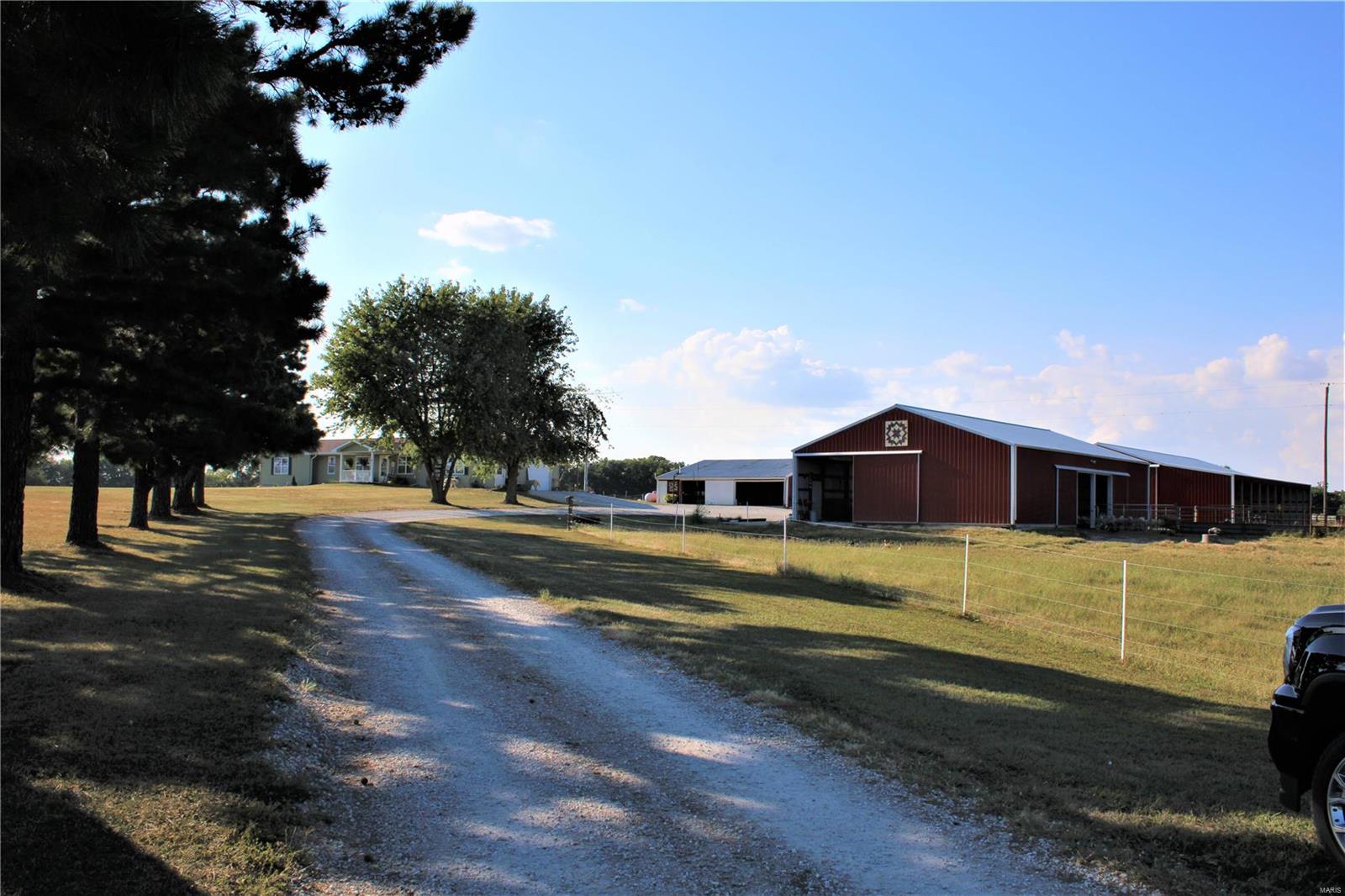 This property located just outside of Paris, Missouri consists of 33 M/L acres. The ranch home has been completely remodeled and features three bedrooms, two and a half bathrooms, and an open floor plan living area. The basement is mostly finished consisting of a large family room and a non-conforming fourth bedroom. The kitchen comes equipped with custom made cabinets, granite counter tops, and all of the kitchen appliances will convey with the sale. There are several barns on the property which include a machine shed, pig barn, and a recently built new barn structure. The property is mostly all fenced with cross fencing and ready for livestock. There is an additional 40 acres which could be purchased and is currently being sold separately. Make sure you bring your chickens to make use of the chicken coop! Come take a look at this well-maintained livestock farm! Additional Rooms: Mud Room