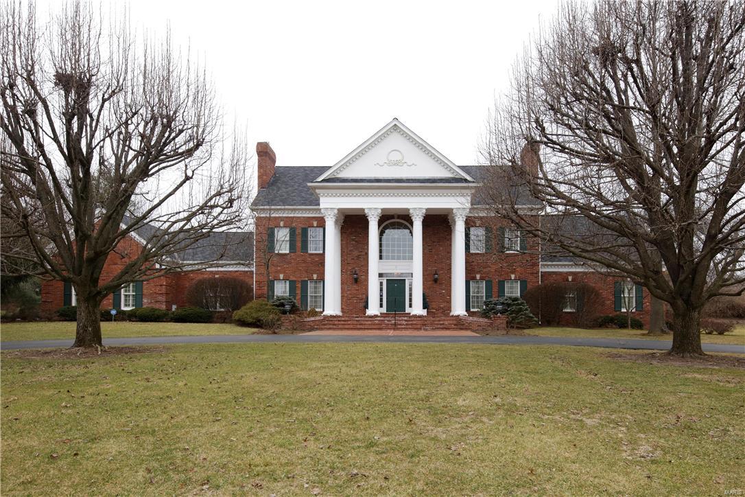 SIMPLE ELEGANCE! GRACIOUS TRADITONAL BRICK sits on PRIVATE ACRE at end of CUL-DE-SAC. This house is impressive from the first moment you enter. Tall ceilings thruout, (10' - 1st flr, some taller w/tray or vaulted ceilings, 9' - 2nd flr) 8' six-paneled doors, floor to ceiling windows, extensive millwork, 5 frpls, plantation shutters, 2 wet bars - just a few of the amenities. Large 2 sty entry has circular stairway, arched openings to LR & DR, marble floor. Step to beautifully paneled Great Rm w/a wall of windows overlooking patio, pool & decking. Enjoy frpl, wet bar & adjacent sunrm w/3 walls of windows that steps out to pool area. Handsome paneled library, also off Great Rm has bay window, blt-in cabinetry/shelves & leads to the 1st flr Master Suite. Additional 3 bdrms on 2nd flr enjoy their own baths. Loft space has blt-in cabinetry/shelves. Kit w/back stairway, has island, desk, many windows & opens to brkfst area. Fin W/O LL w/frpl, dance rm & sauna. 4 car gar. ENTERTAINER FRIENDLY! Additional Rooms: Sun Room