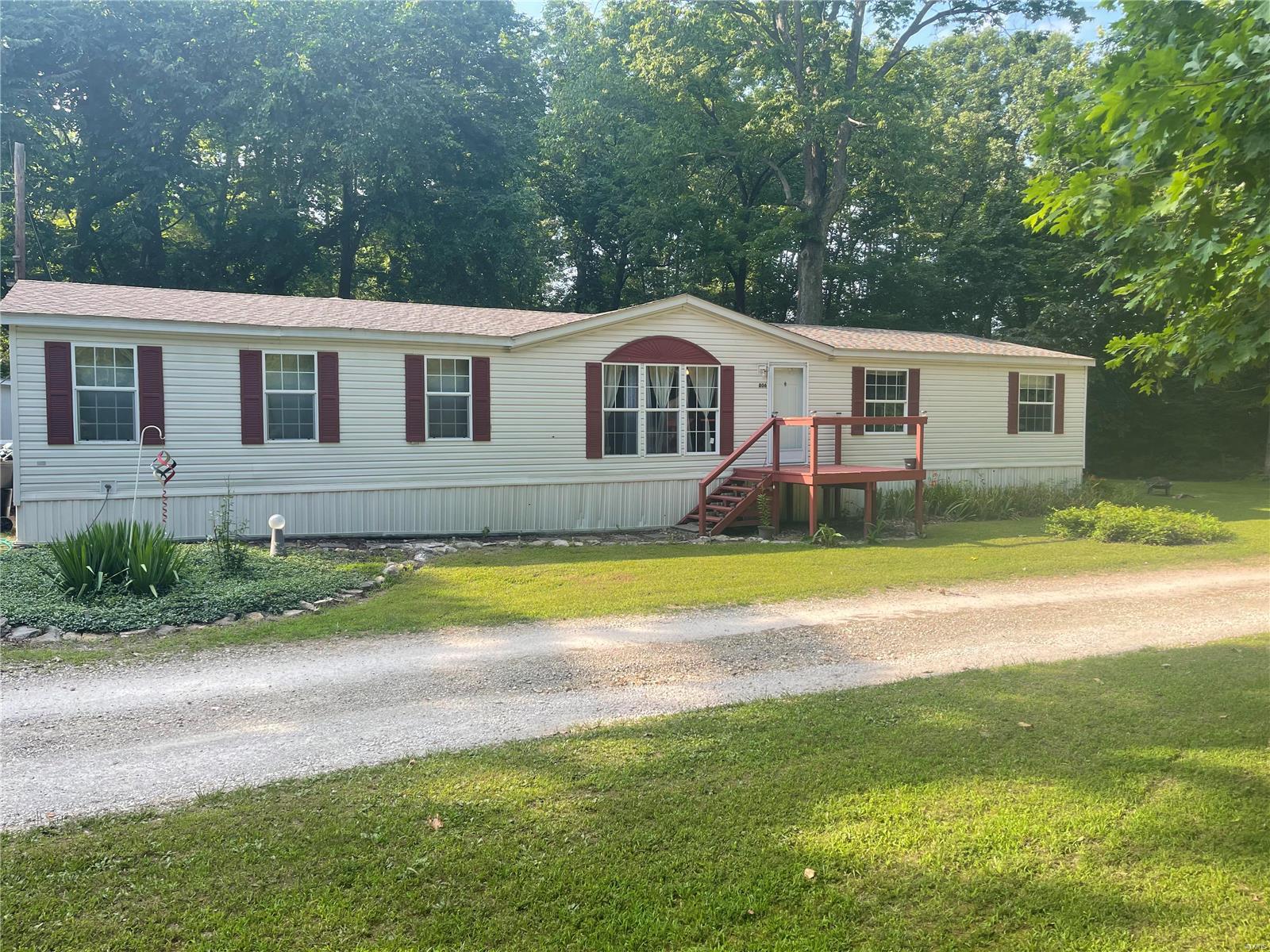 Take a look at this 4 bed room 2 bath manufactured home. It sits on 1.37 acres with a small creek passing through. The abundant wildlife and quiet country living makes this ideal home, yet not too far from the city. 2 car garage, small work shop and a storage area sit on the property. The rooms are large and open. Plenty of room everywhere. Backyard is fenced and secure. This is move in ready. House is selling as is. Sellers to do no repairs.