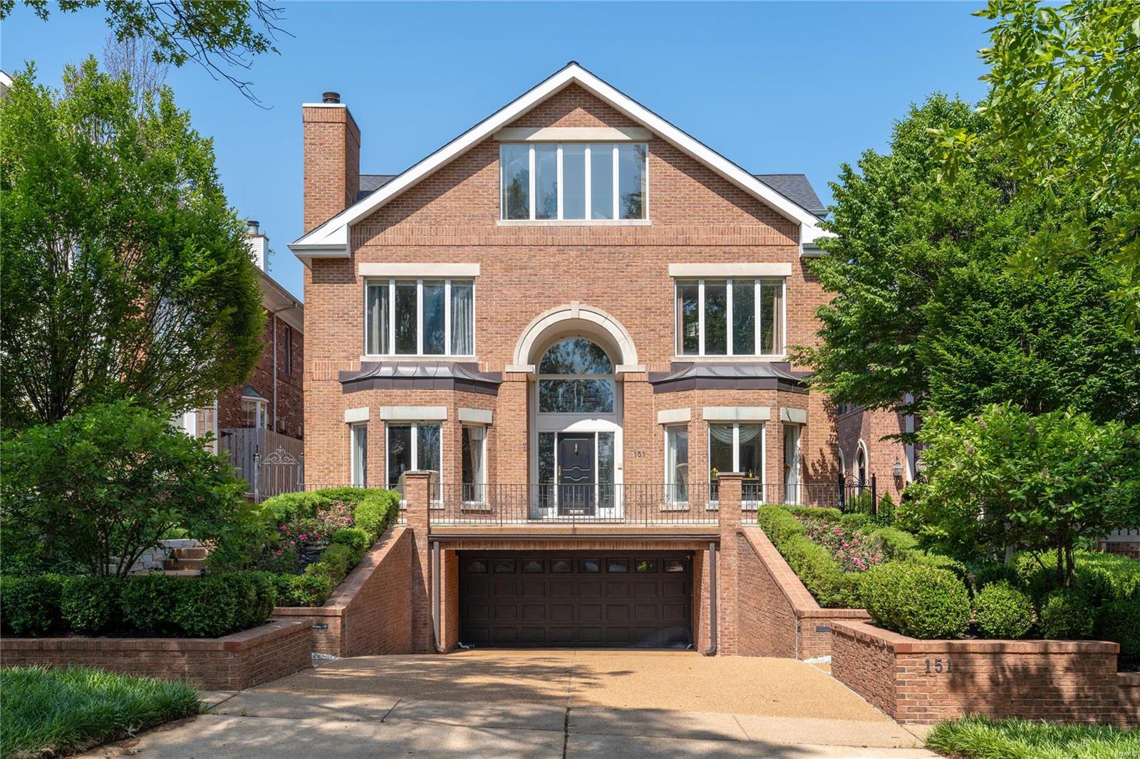 Outstanding Old Town Clayton home offering approx. 5,986sqft with dramatically designed open floor plan and elevator to all floors: soaring two story entry w/marble flooring opens to living room w/fireplace & dining room, both with 10' ceilings, two story great room w/herringbone wood floor & fireplace, gourmet kitchen w/custom cabinetry, center island, full size Subzero refrigerator, full size Subzero freezer, 2 dishwashers, Gaggenau double ovens, breakfast area, spacious master suite w/vaulted ceiling and leads to beautiful yard & pool, his/her master baths, walk-in closets, laundry room/pool bath also leading to yard & pool completes the main level. Second level: balcony overlooking entry hall & great room, 3 additional en-suite bedrooms, 2nd laundry room. Third level: large family room w/cathedral ceiling & skylights, game room, office/possible bedroom 5 w/wall of windows, full bath. Lower level: recreation area, cedar closet. Oversized 4+ car garage. Walk to shops and restaurants!