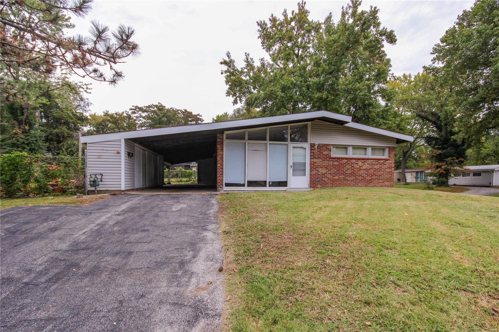 Don't miss out on this great opportunity! This renovated home is move-in ready! Perfect for an investment or make it your own! The living room features exposed brick and vaulted ceilings. You'll love the open kitchen layout and newer flooring throughout the home! The fenced yard provides plenty of space to relax outside in the warmer months, and you can enjoy off-street parking in the carport. Moments from highways, schools, parks, and restaurants, this home is ready for its new owners!