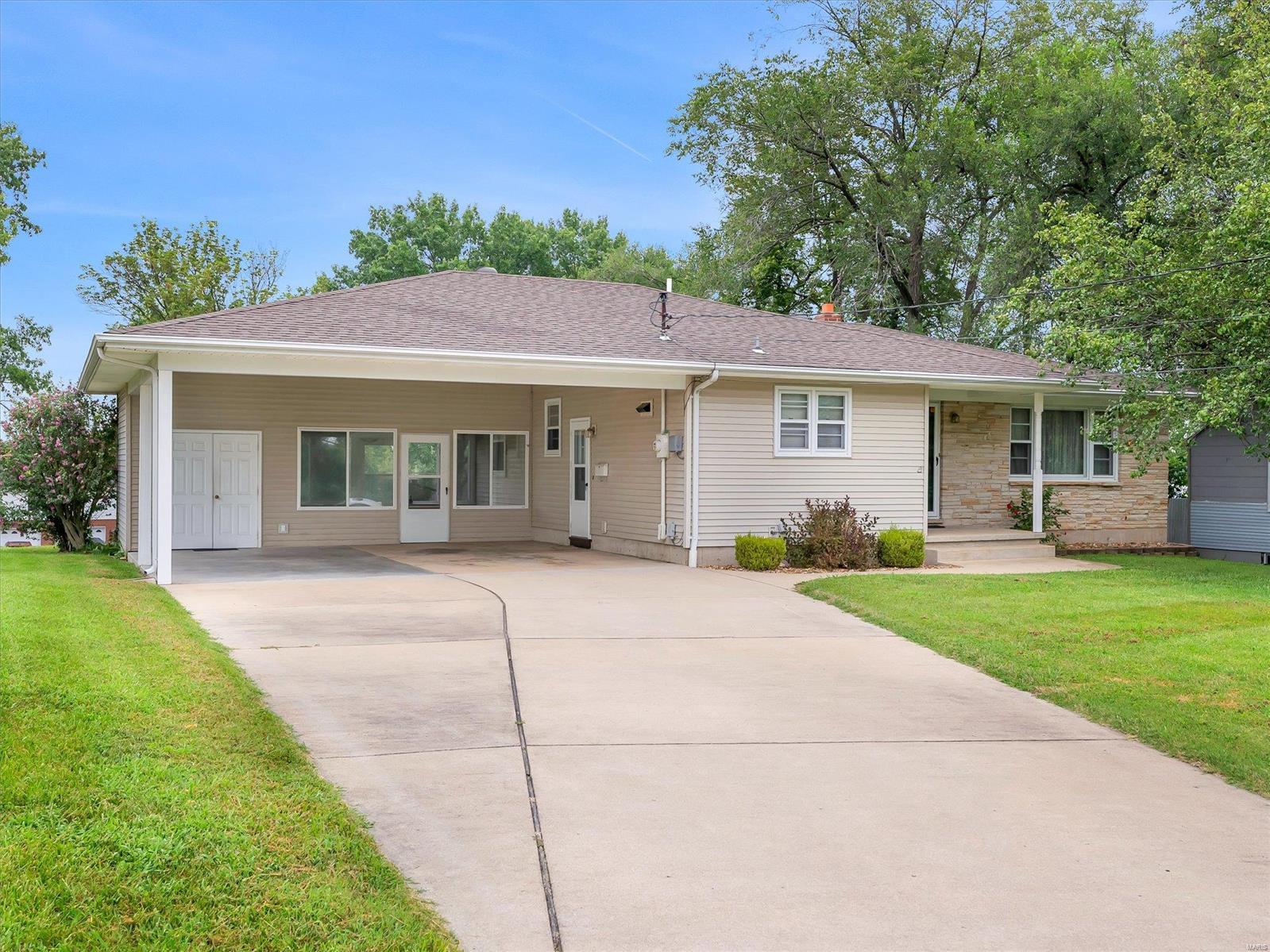 THIS IS A SPECIAL 1st TIME TO MARKET HOME YOU WONT WANT TO MISS! A beautiful ranch with lots of character, classic style, updated kitchen, updated HVAC AND beautiful lot layout with long concrete driveway for plenty of off-street parking. 
A 3 bed, approx. 1.5 bath, home with basement finish that features: A large bonus sleeping/workout/media/office, recreation room & built-in bar & 2ND BATH! Enter the classy midcentury-styled front door into the main large great room with coat closet, dining area w/ glass cabinet built-ins, a traditional hall floor plan offers nice-sized bedrooms & full hall bathroom.  The updated kitchen shows off soft-close cabinets, tiled backsplash, tile floors and all appliances.  Bonus - narrow plank hardwoods exist under MF carpet, nice oversize double carport w/ extra storage/workshop area, breezeway/enclosed porch to lg back patio overlooking the backyard for IDEAL entertaining spots for gatherings.  A great location within a walk to town square. MUST SEE!