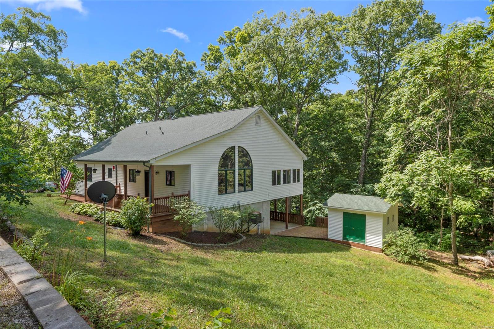 A Beautiful Custom Home Set Back Off the Road on 7.3 Acres of Woods. This 2 Bedroom 2 1/2 Bath Ranch has 2564 sf of Living Space-9' High Main Floor Ceilings-Heart Pine Flooring Throughout the First Floor-Each Bedroom is Setup as a Master Suite with a Large Walk in Closet & Full Bath-Kitchen Features Custom Built Wood Cabinets and Solid Surface Countertops with an Overhang Breakfast Bar-Hearth Room has a 12' High Vaulted Pine Wood Ceiling & a Large Arched Window Set-Huge Family Room with Walls of Windows to Enjoy Nature Watching-Main Floor Laundry-Open Staircase-Large Lower Level Recreation Room-Built in Concrete Gun Safe under the Stairs-Large Storage Room-Covered Front Porch-Large Covered Back Patio-Over Sized 2 Car Garage-12 by 12 Storage Shed-Walking/ATV Trails Cut Through the Property-Just Landscaped-Possibility of Adding a Third Bedroom by Using Part of the Main Floor Family Room or the Lower Level Recreation Room.