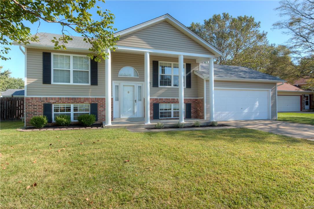 WOW! Priced to sell! This home is the absolute perfect starter home! It boasts 3 bedrooms, 2 baths, oversized 2 car garage, over 1500 sq ft of living space, a great composite deck and HUGE fully fenced yard! The front of the home has 4 majestic columns, brick veneer and newer siding! The curb appeal is fantastic! 

Come inside and be welcomed by newer carpet throughout, newer kitchen and bathroom floors, vaulted ceilings, large open kitchen and space galore! The lower level has a great room for entertaining, a full bathroom and storage!

The neighborhood is conveniently located near many major roads: Hwy K, 70, 40/61 and the Page Extension! You can get anywhere quickly! Shopping, restaurants and entertainment just a stone's throw away! Plus this home is located in the fantastic Ft Zumwalt school district! Put this on your must-see list and make an appointment! Do not blink or this home will be a memory!