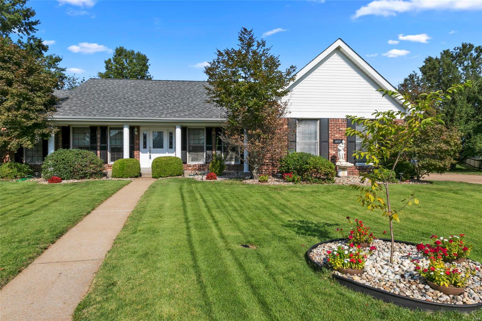 Situated on a cul-de-sac, the meticulously maintained landscape invites you into this 3-bedroom, 2 bath, 2122 square foot Ranch. Hardwood in the foyer, separate dining room, and separate living room. Lavish wood crown molding and chair rails make these rooms feel regal.  Partially opened to the family room, the kitchen and breakfast room have bright windows, ceramic tile and a glass door to the patio for entertaining. The family room vaunts a wood burning fireplace & built-in surround speakers.  Divided bedroom floor plan with master en-suite, separate and walk-in closets, jacuzzi tub and separate shower. The two other bedrooms are similar sized with hall bath between. Main floor laundry right off of the garage. Partially finished basement with sleeping room and large rec area. The unfinished area is vast with built-in shelving and wood working area. Quaint subdivision just off Old Halls Ferry, close to restaurants, shops, and public transportation on HWY 67.