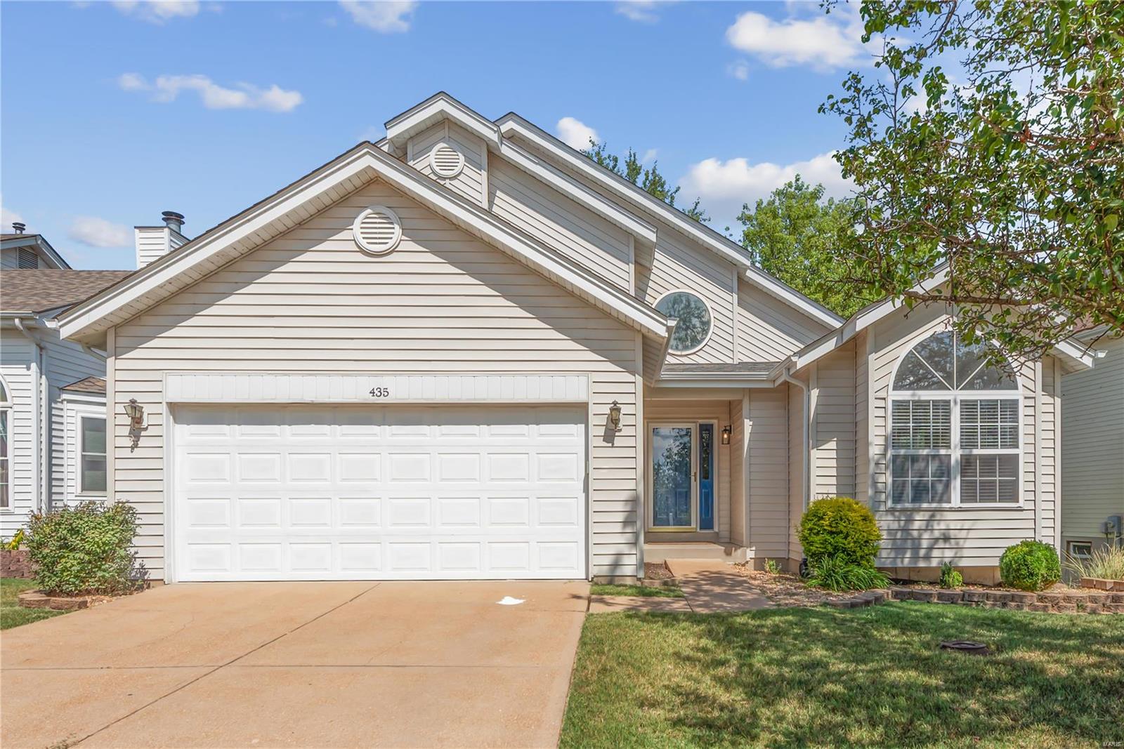Welcome to this desirable 1.5 story floor plan with main floor primary suite. The family room is the heart of the home featuring a woodburning fireplace, soaring vaulted ceiling & large windows that bring in plenty of natural light. The family room is open to both the kitchen & dining area, creating a seamless flow. A sliding door leads out to the deck, offering additional outdoor living space. Enjoy the new stainless Frigidaire appliances in the kitchen. The main floor primary suite has a walk-in closet, bath with double sinks, separate tub & shower & bay windows with newer door to the deck. Upstairs are 3 bedrooms & the hall bath. Additional features include a half bath on the main level, 6 panel doors, 2 story entry, 2 car garage, new roof, & 2 sides of new siding. The deck overlooks the fenced, wooded backyard & common ground.  The unfinished walk out lower level has a new sliding door & lots of potential for additional living space. Great lot with no neighors across from the home.