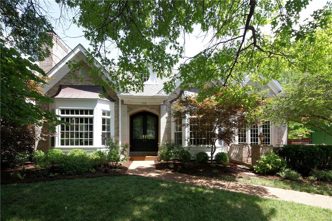 Newer construction in Clayton Gardens! This home has been updated & transformed to reflect today's style. As you enter you notice the dramatic 2 story entrance and the gracious center hall plan. The living room and dining rooms both feature lovely crown molding and bay windows overlooking the front of the property. The 2 story bar room adjoins the kitchen/hearth room and is next to the dining room. There is a lovely patio off the bar room as well. The updated kitchen was featured in St. Louis Homes Magazine for its high end style & innovative design. The kitchen is open to the hearth room and breakfast room. The main floor master is spacious and has French doors that lead to the backyard. The updated master bath includes double sinks, jet tub & large walk-in shower. Three additional large bedroom suites are upstairs along with a laundry room.The finished lower level has great spaces and a full bath plus tons of storage. A fully fenced yard & main level garage add to this fabulous home