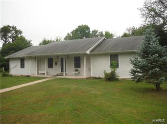 This is a lovely home needs new carpet and some TLC. Built by a Builder for himself.  Feature Custom Cabinets, Fireplace with insert,
wood floors deck, covered porch, on a terrific lot.   Must see appointment only.