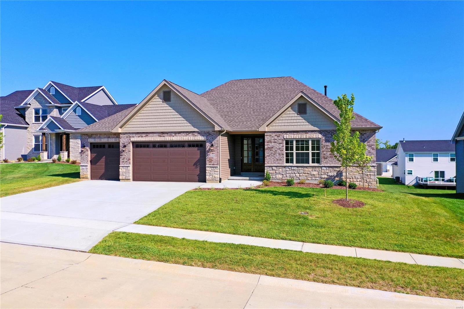 This Grant Model by Zykan Homes is completed and ready for you to move in! It has so much that you'll love such as a covered composite deck, 3 car garage w/ 8ft garage doors and 2 wi-fi openers, 10ft ceilings in the great room w/ crown molding and 9ft ceilings elsewhere, wood burning fireplace w/ stone surround, gorgeous kitchen with large island, granite countertops, tile backsplash, and 42" cabinets w/ soft close doors and drawers and under cabinet lighting. Upgraded appliances w/ Frigidaire Professional gas range and ultra quiet dishwasher, drawer microwave, and range hood. Laminate flooring throughout the main living area w/ tile flooring in the bathrooms and laundry room. Master bath features separate adult height vanities w/ quartz tops, huge walk in tile shower w/ frameless shower door, 2 shower heads, and seat. The 2 secondary bedrooms have a shared bath and there's a powder room for guests. The laundry room has a utility sink, built in cubbies, and a separate drop zone.