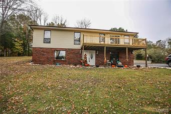 MOTIVATED SELLERS! Offering One year home warranty. Spacious home, open floor plan. Brand new large front deck with lake views! House backs to a large hay field with an abundance of wildlife on over 1.5 acres. You will be ready to boat on the largest lake in the area. The house has many updates! Including the kitchen with Quartz counter tops, both bathrooms, updated electrical, some new plumbing, new heating and air unit this summer, new attic fan this summer, all new flooring throughout entire house, ALL new interior AND exterior doors, all new light fixtures and ceiling fans with remote throughout, fresh paint throughout, and much much more! Enjoy relaxing in the 6x4 jetted tub in the master bathroom!