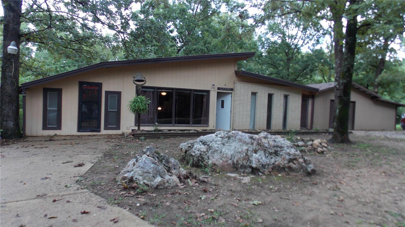 Lovely contemporary, 3 bedroom, 1 bath, open floor plan, detached garage with work shop area, storage shed on large lot with peaceful outdoor patio area backs to woods. Must see this property to appreciate all it has to offer. Close to fishing & boating at Lake Wappapello.