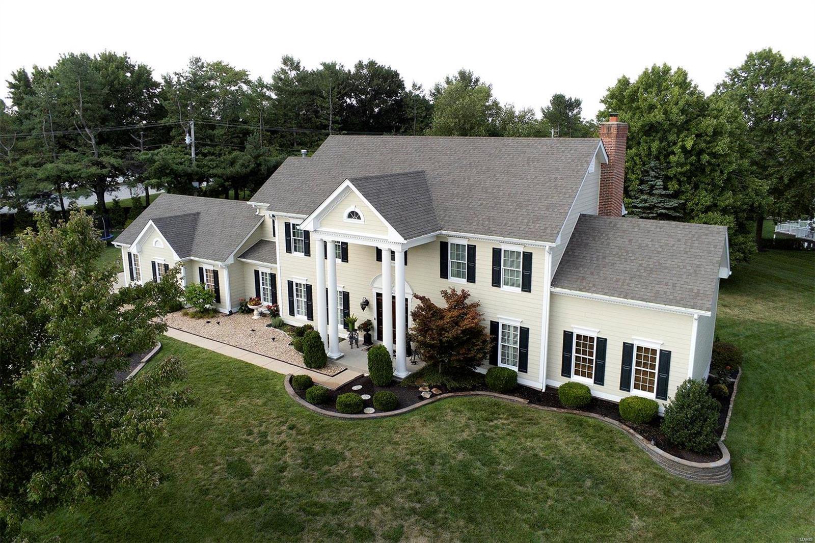 Situated on one of the largest and most private lots in Brook Hill Estates, this Micelli built, James Hardie Board home is a rare find in the neighborhood. Exquisite designer kitchen w/ all top of the line KitchenAid appliances & main floor laundry. The large family room has a custom built gas fireplace and bar that leads into the relaxing Florida room with views of the picturesque patio & pool. French doors open to a private main floor office. The upstairs master bedroom has a vaulted ceiling, custom bath & large walk in closet. 3 more bedrooms (one has ensuite bath and the other two share a Jack and Jill bath) complete the 2nd floor. The lower level is perfect for entertaining with a spacious living area with a complete bar, a custom office with built in bookcases, a work out room & a full bath – all finished with the same integrity and quality as the upper floors. Enjoy the gorgeous backyard adjacent to Logan College’s stocked fishing lake and scenic trails. You will love this home! Additional Rooms: Sun Room