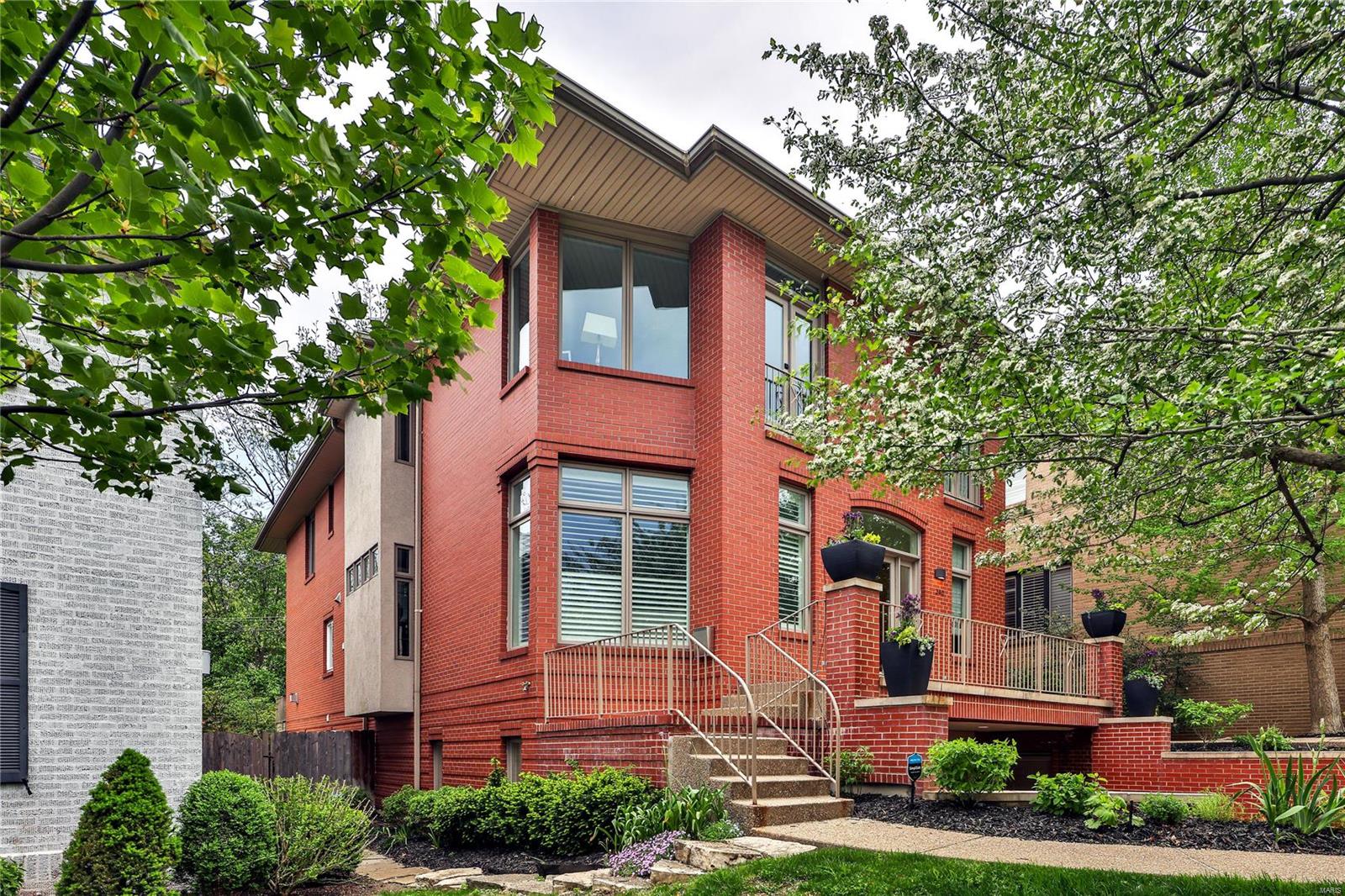 Welcome to 342 N Central Ave. This 4-bd, 3.5-bth Clayton home exudes modern luxury and low maintenance in a lovely natural setting. Tall ceilings, abundant windows, white oak flooring, and skylights create a light, bright home. Long stretches of quartz countertops, GE Cafe appliances, expanded pantry, and extended island are sure to delight the chef in your family. Eat in the dining room, breakfast nook, or on the deck off the kitchen. Upstairs are 3 generously sized bedrooms and a conveniently located laundry. The Primary Suite has a custom wardrobe and a spa-like bath. Walkout garden level has another ensuite bedroom which could be used as a work at home space, along with an oversized tuck under 2-car garage. The private elevator services all 3 floors and makes for easy living. Numerous upgrades, including a new high-efficiency HVAC. The fabulous, fenced back yard is lush with native plants that attract birds year-round.  Exceptional Old Town Clayton location is a walker’s paradise. Location: End Unit