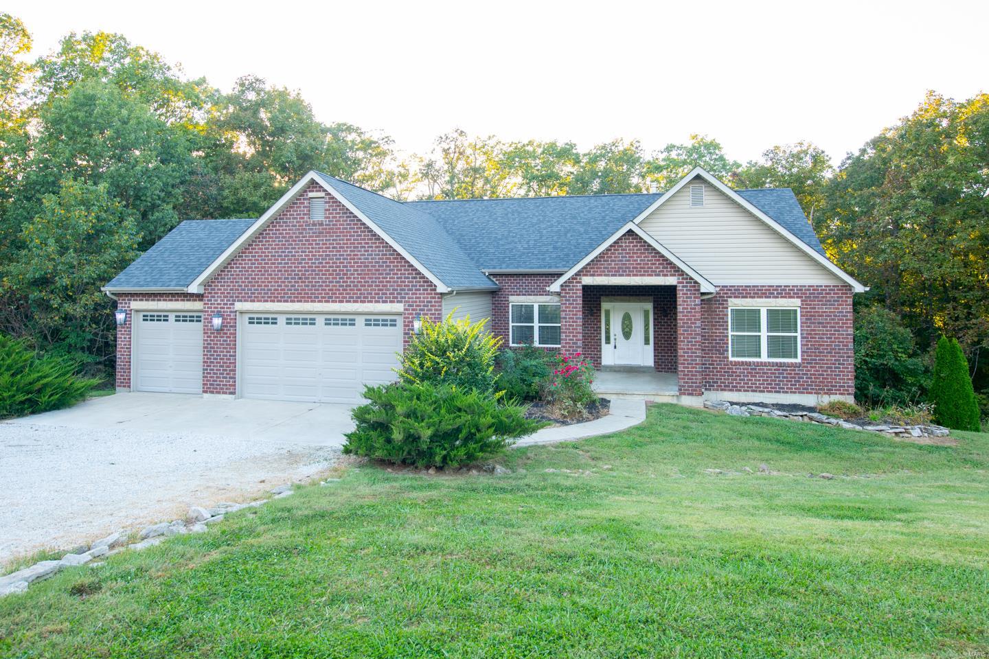 You will want to call this house you home.  Scenic 3 acres surround this beautiful 4 bedroom ranch home with 3 car garage.  Hardwood floors and plenty of sunlight.  Vaulted ceiling in great room, built in bookcases and a wonderful wood burning fireplace.  Lots of room for entertaining.  Master bedroom has vaulted ceiling and large bath with double sinks, jet tub and separate shower.  Other bedrooms share a Jack and Jill bath.  Main Floor Laundry.  Lower level has a large family / rec room, built in bar area, 4th bedroom and media room.  High efficiency HVAC, 80 gallon water heater and water softener/purification system.  Just a short jaunt to the Katy Trail, Klondike Park, and local wineries.  Don't let this one get away.  Schedule your showing today! Additional Rooms: Mud Room
