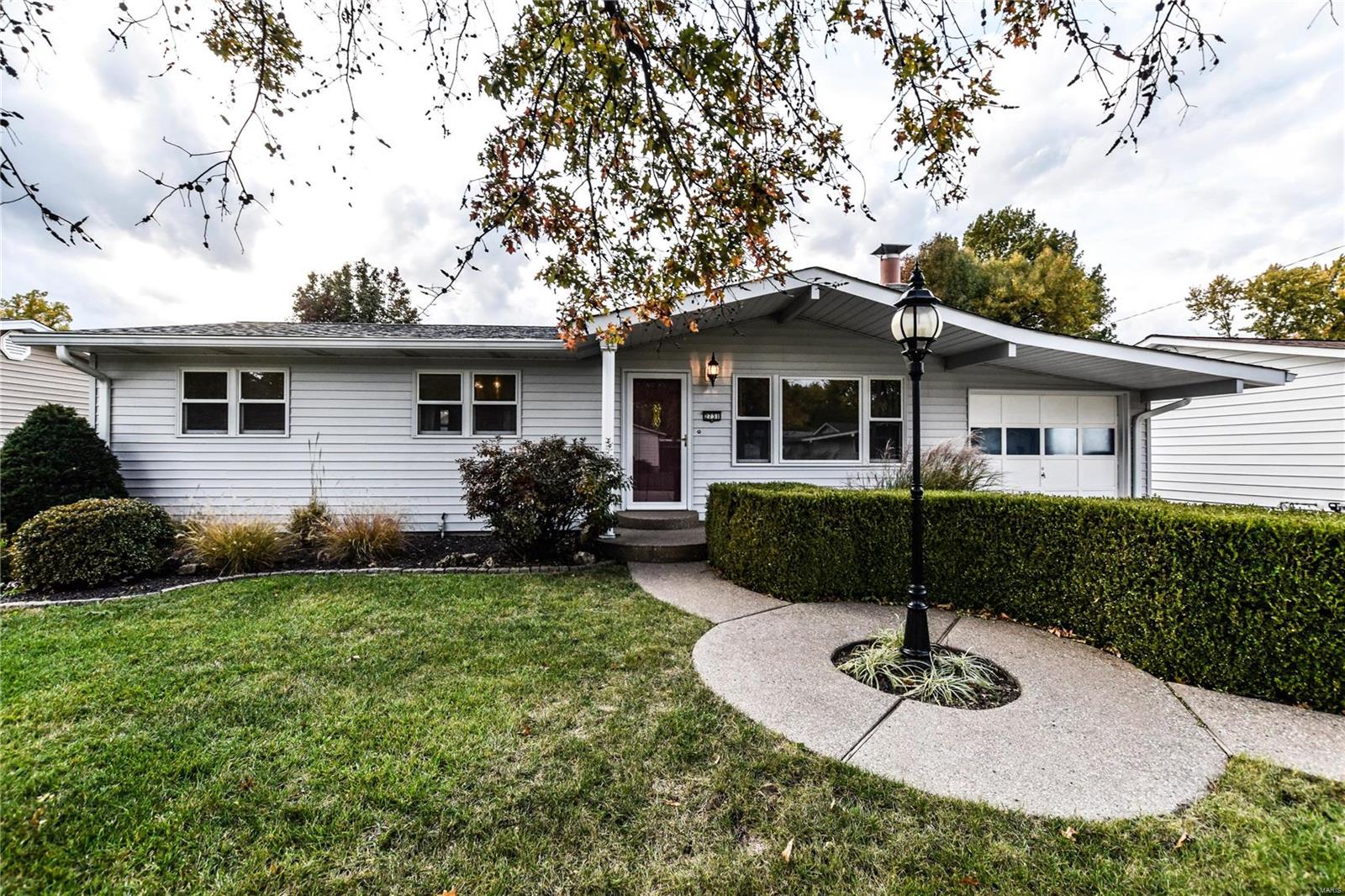 Beautiful 3 bed, 1.5 bath ranch home in desirable Arrow Heights Subdivision. Pride of ownership abounds with tons of custom woodwork and extra details. Enter the large living room with vaulted ceiling and hardwood floors. Lots of natural light thru Pella windows with built-in blinds. The kitchen is completely custom and boasts beautiful cabinets with pull-outs, real wood paneling, ceramic tile, and newer appliances. The 3 bedrooms are spacious and beautifully finished. There's a large Sun Room attached in the back of the home, and a large partially covered patio. Plus!! A large (2 car garage sized) workshop is a detached in the rear of the home with plenty of lighting, electric, and plumbed for air compressor lines.

All the windows on the main level are high quality Pella windows with built in blinds. The Architectural Roof is approximately 2 years old, and the HVAC is less than 5 years old, and there is a beautiful landscaping in the front and rear of the home. Additional Rooms: Sun Room COOL: 14 SEER+