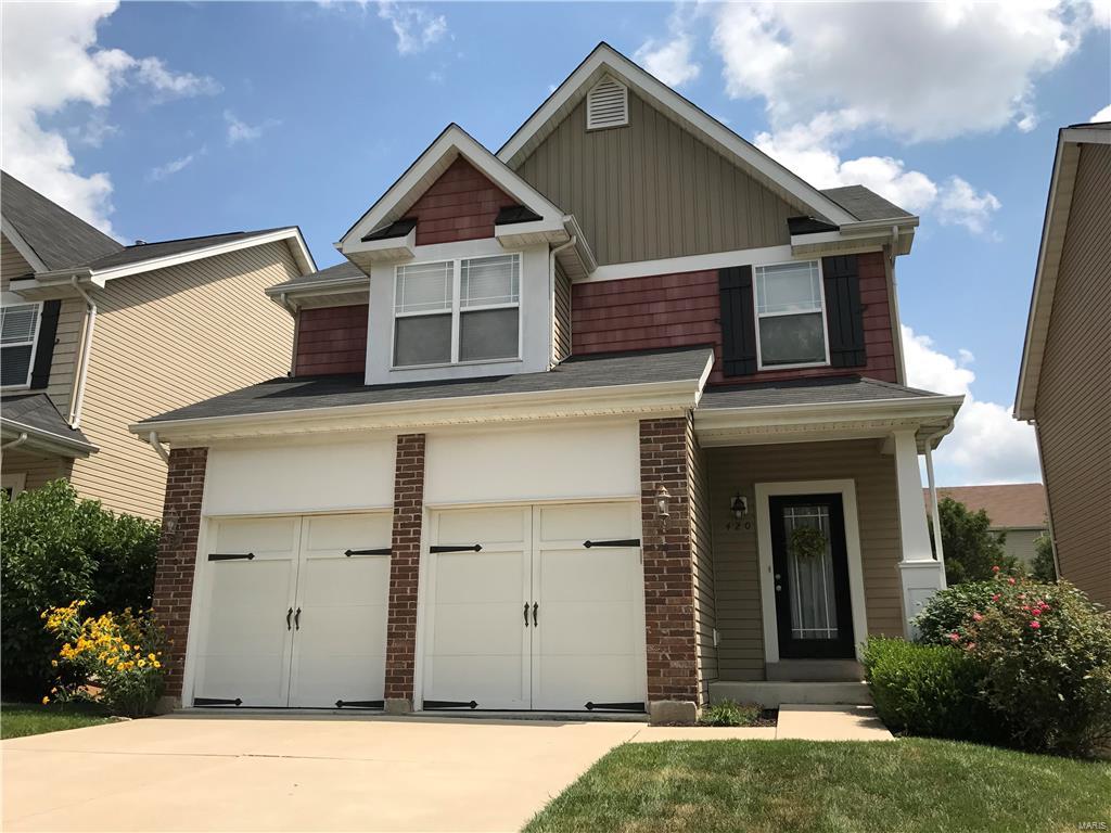 The beautiful home includes a Walkout Basement on a lot that backs to woods, 9Ft Ceilings on First Floor. Hardwood Flooring on the Main Upgraded Custom Cabinetry Throughout, 42 Inch Wall Cabinets in Kitchen, a Roughed bat at the Lower Level, custom trim, Window in Breakfast Room, Separate Shower and Tub in Master Bath. Wyndgate Commons is surrounded by 55 acres of lush common ground and amenities galore: 4 neighborhood parks, paved bike and walking trails, covered picnic area, sports courts, swimming pool, playgrounds and a tranquil lake. Cottage series homes you don't have to worry about mowing, mulching, pruning and weeding your fully sodded and landscaped yard...it's done for you, even snow removal! Location: Detached