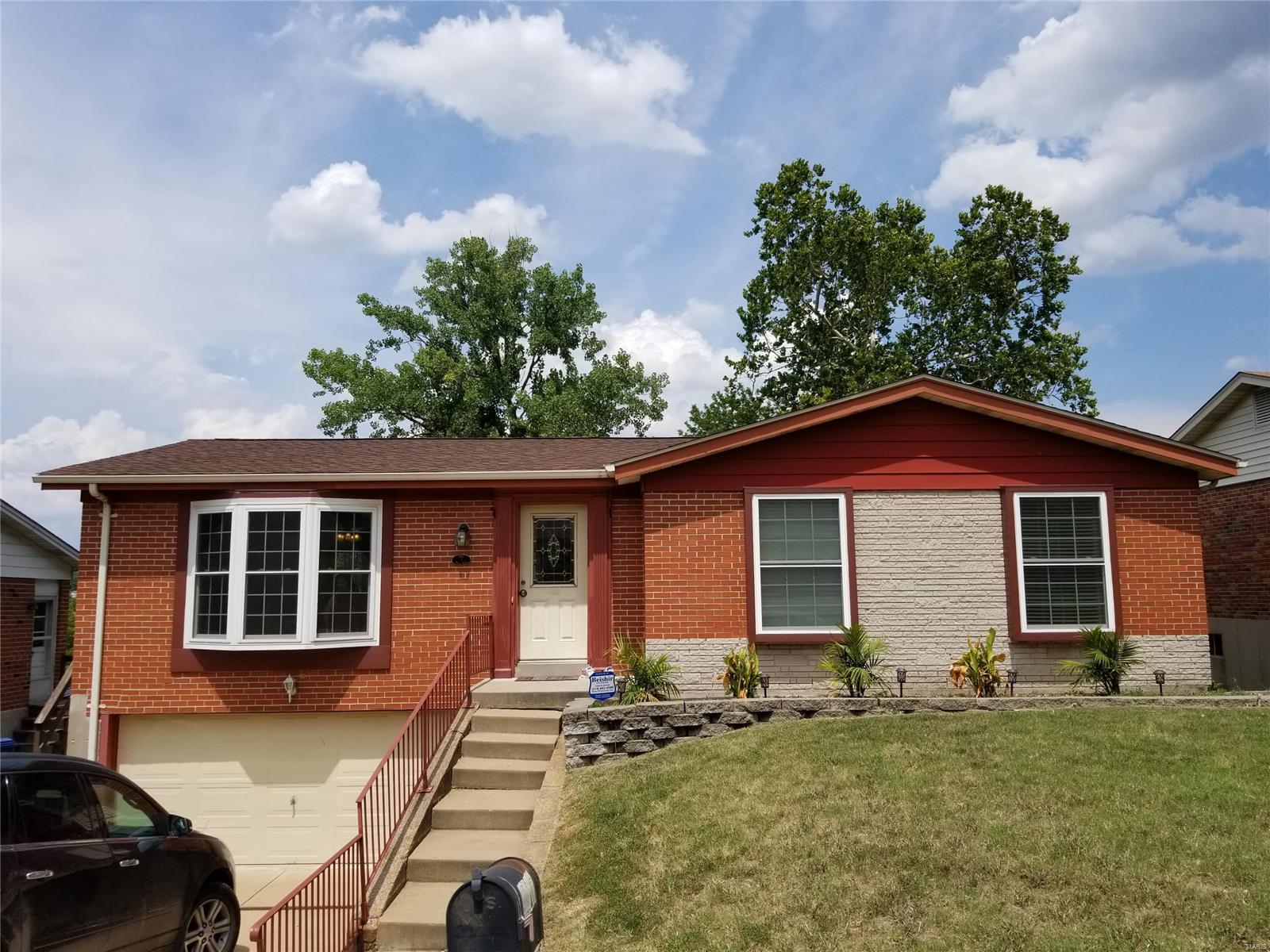 Welcome Home!!!  Check out this wonderfully updated 4 sides brick ranch home in a super sweet location just off Union Rd.   This 3 bedroom 2.5 bath home boasts hardwood and ceramic flooring throughout the main floor, and laminate flooring in the finished lower level.   Home has been freshly painted and has been updated with stainless steel appliances, nice modern lighting, newer insulated windows, newer HVAC, newer roof, the list goes on and on.   The large deck off the dining room overlooks the large fenced yard.  The 2 car tuck-under garage is extra deep for more storage or a workshop in the back.   The lower level has a finished family room with a kitchen area, as well as additional storage space.  AHS Home Protection Plan is included for your peace of mind!  Hurry in, this one won't last!!!