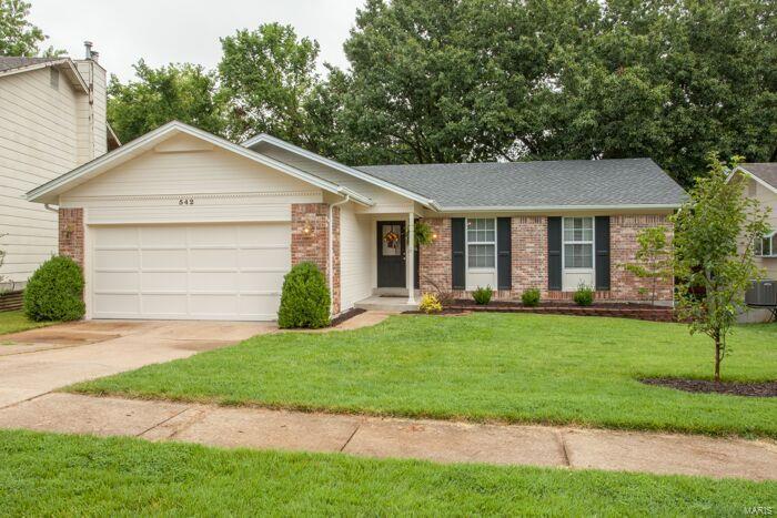 Phenomenally updated 3 bed, 3 bath home with finished walk out basement! Soaring vaulted ceilings and open floor plan will greet you upon entering! Spacious eat in kitchen boasts newer microwave and dishwasher with countertop overhang perfect for additional eating space! Living room and dining room offer gleaming hardwood floors with wood burning fireplace! Step outside onto the large freshly stained deck overlooking a private wooded setting! Main floor master suite with vaulted ceiling and recently completed brand new master bath! Hall bath offers brand new ceramic tile flooring and is freshly painted! Recently upgraded light fixtures throughout most of interior! Walkout lower level boasts TONS of finished space and an additional guest suite/den with its own updated private bath! All carpet in lower level is brand new! New roof and landscaping in 2015, newer front door, much of exterior is freshly painted! Located on a quiet culdesac street, this home is a must see and will not last!
