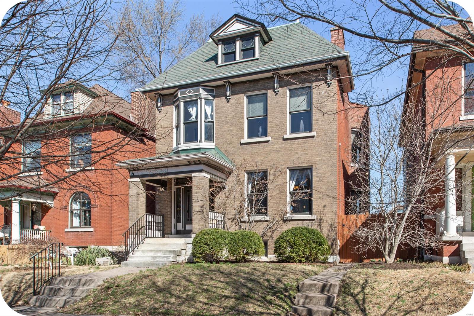 Majestic 2 story on one of THE premiere blocks of Tower Grove Heights. Nestled perfectly just down from the South Grand District, the original charm and high end finishes abound throughout this lovely home. Lots of space in the welcoming living & dining room areas-note the pocket doors, fireplace mantle & woodwork.  Dining area opens up to a gorgeous kitchen with Thermador range/oven & Jenn-Air refrigerator! Upstairs you'll find a cozy primary suite w/separate bath, walk-in shower & dual sinks. 2nd bedroom is sun drenched & cheery. 3rd bedroom is perfect for children's room/office/studio. Next to 2nd fl laundry is 2nd full bath with a dreamy claw foot tub. Outside is a spacious deck & a wonderland of a yard waiting for your personal touches.  Also a private fence and 2 car carport! Stroll up the street for easy eats at Rooster, Cafe Mochi, Steve's Hot Dogs or Gelateria! Steps from Tower Grove Park's farmers markets, jogging paths, yoga & Food Truck Fridays.