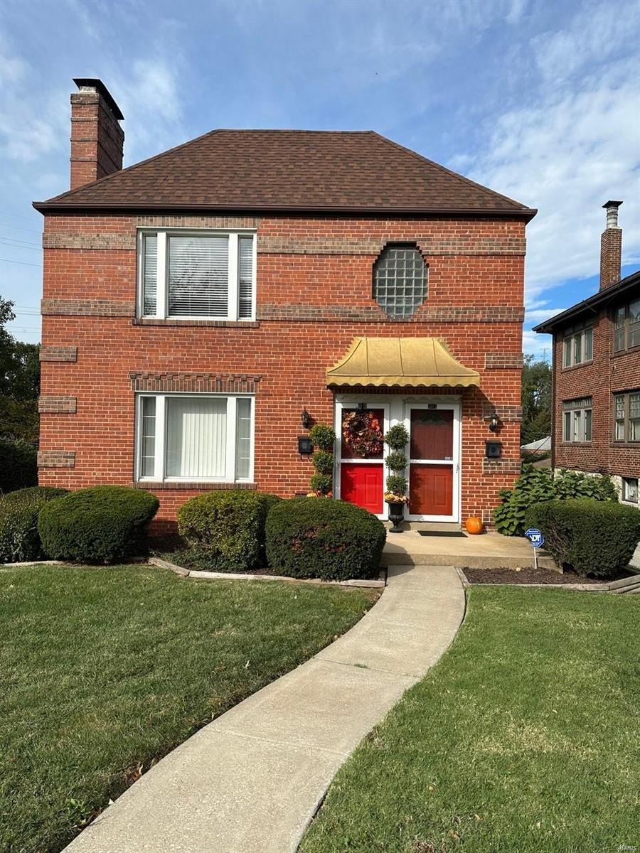Charming brick duplex in CLAYTON SCHOOLS! This upper level unit features two bedrooms and 1 bath, some hardwood floors, crown molding, gas FP, & white 6-panel door, kitchen has white cabinets, enclosed porch w/french doors*Basement w/storage available, washer/dryer hook-ups, Level & partially fenced backyard. Highly sought after Clayton Schools, near Brentwood Promenade, downtown Clayton, & Forest Park. Location: Upper Level