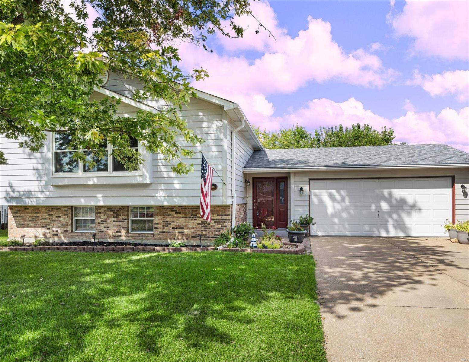 Welcome to your dream home! This stunning 5 bed, 2.5 bath residence offers a perfect blend of modern amenities and classic charm. Nestled in the highly desirable McClay Valley Subdivision in St. Peters, this home is part of Francis Howell School District and walking distance to Laurel Park. The main level boasts windows that flood the space with natural light in a huge open living and dining area. Head to the eat in kitchen featuring granite countertops and solid wood cabinets. Down the hall has the primary suite plus 2 additional bedrooms and another full bath. The entrance foyer heads out to the oversized garage and deck to enjoy the tons of outdoor living space. The lower level offers a large family room with a fireplace, 2 more full bedrooms, a 1/2 bath and sliding doors that lead straight out the huge backyard and patio.