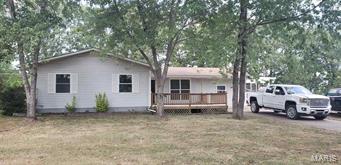 NEW LISTING: Amazing, totaling remodeled 4 BR, 2 BA home just minutes from town in beautiful subdivision. This large family home offers beautiful kitchen, large utility, beautiful screened in porch and large front deck. This home is in mint condition and ready to move in. Large yard has abundance of shade. Must see