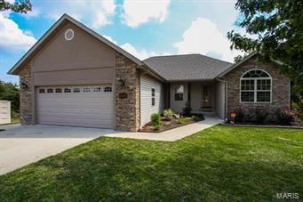 Located in the Ridge Creek subdivision with over 3300sqft is this 6 bedroom 3 bathroom ranch-style home which sits on a full finished walkout basement. Enter the lavish living room which highlights laminate wood floors, vaulted ceilings and a gas fireplace. Next, step into the dining area and kitchen which feature ceramic tile floors, glass tile backsplash, huge bay window, walk-in pantry, stainless steel appliances and saddle brown cabinets with crown molding.  The spacious master bedroom features a trey ceiling with recessed lighting, a walk-in closet, while the floors are carpeted. The full master bath features ceramic tiled floors, corner jetted tub, a tiled separate shower and a double vanity sink. Head downstairs to the large family room which is great for entertaining friends and family. Find 3 more bedrooms on the lower level with the 6th bedroom not having a window.  Step out to the back deck and take pleasure in the fantastic view and landscaping. Call to schedule a showing!