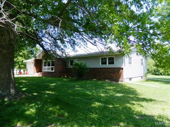 FANTASTIC FAMILY HOME ON THE EDGE OF TOWN!!! Very nice and spacious 3-4 bedroom ranch-style home at the city limits of Owensville! Well-maintained with newer windows and freshly painted. Main-level laundry, lots of closet and storage space. Lower level family room area with wood-burning stove. Back patio and attached 2-car garage. Sits on almost 2 acres with many beautiful trees and landscaping, plus storage building. On blacktop street with city water and sewer. Seller is providing buyer with a one-year American Home Shield warranty plan. Convenient location and what a great place for raising a family!