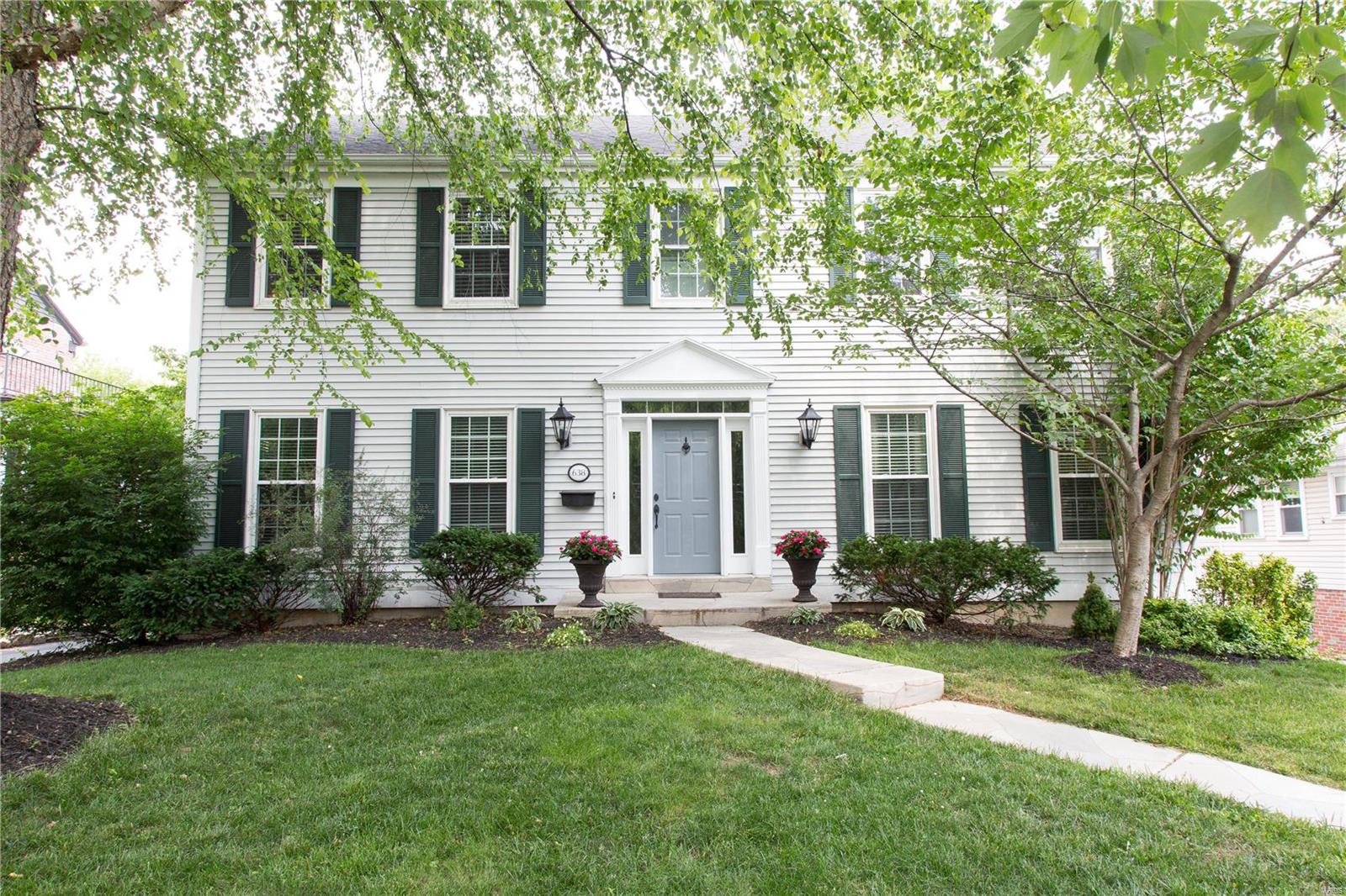 Ideally located in the middle of all that Webster & Kirkwood has to offer, move right into this wonderful home! When you walk into the front door you will immediately love the comfortable & warm feeling. The open living room flows right into the large family room complete with fireplace and built-in bookcases - definitely a perfect spot for movie night! The adjacent kitchen has everything a cook could want: a large center island, stainless steel appliances, granite counter tops, views overlooking the outdoor deck, and a separate wet bar with built-in wine cooler. From doing homework in the breakfast room to dinner parties in the formal dining room, this home can handle it all! Upstairs you will find 4 large bedrooms, new carpeting & laundry room. The master is complete with 2 walk-in closets & a beautiful bathroom that was recently remodeled from top to bottom.  Downstairs, the finished basement adds even more living space. Electronic gate and a huge 2 car garage finish things off.