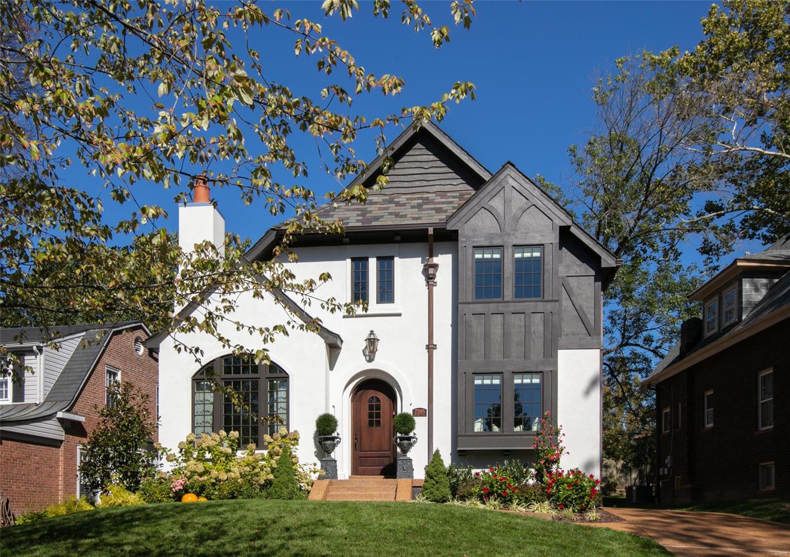 Meticulous 3 year old, Period Restoration built home in popular University Hills. This Dick Busch designed home was inspired by the old world elegance & charm of Maritz & Young architecture. The level of finish inside and out is unrivaled in new construction these days. Hallmarks of this design include hand-hewn beams in the living room, custom wrought iron railings, slate roof, copper gutters, downspouts & incredible custom appointments throughout. The spacious main floor master bedroom includes a stunning marble bath & walk-in closet. The kitchen boasts custom cabinetry, Miele and Wolf appliances & leads outside to a new patio and grilling area. Upstairs you will find 3 additional bedrooms, each with custom finished walk-in closets & 2 full baths. The lower level includes a family & an additional full bath plus loads of storage. The owner has made add'l improvements to the home that have added to its livability and enjoyment. This special home appeals to buyers of all generations.