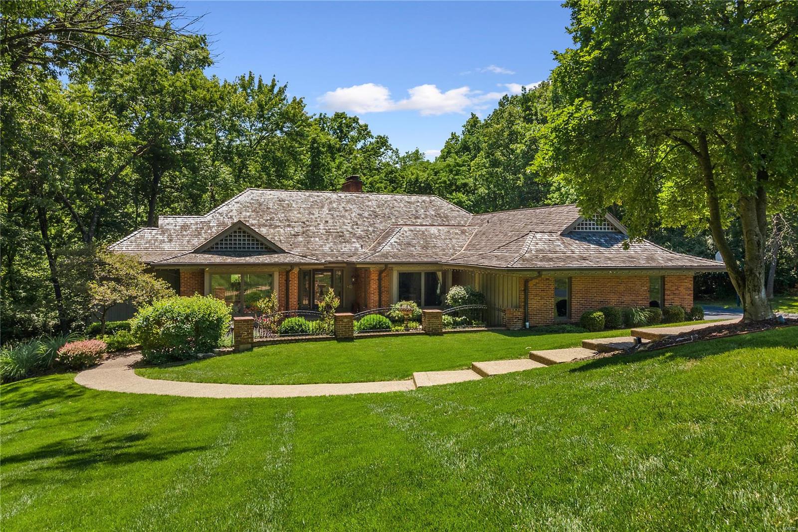 Exceptional 1.5+ acre setting with updated pool and backs to the lush Queeny Park! This ranch home is tucked in the back of the Kings Glen Subdivision on a cul-de-sac and has been lovingly maintained. Oversized entry leads to formal living & dining areas as well as the heart of the home - a hearth room opens to eat-in kitchen & surrounded by windows overlooking the pool and the vast park land in the rear. Step off the hearth room to a massive partially covered deck that feels like its floating in the dense forest. Main floor master suite & 3 additional bdrms plus 2 full baths in the walkout LL that lives and feels like the main. Oversized family room, game room and kitchen in the LL make entertaining around the pool a dream. This property is perfect for the discerning buyer looking for extreme privacy surrounded by 100's of acres of park land. Exceptional access to all that Town & Country has to offer, & adjacent to hospitals, schools & highways. Hop on the T&C trail system and enjoy!