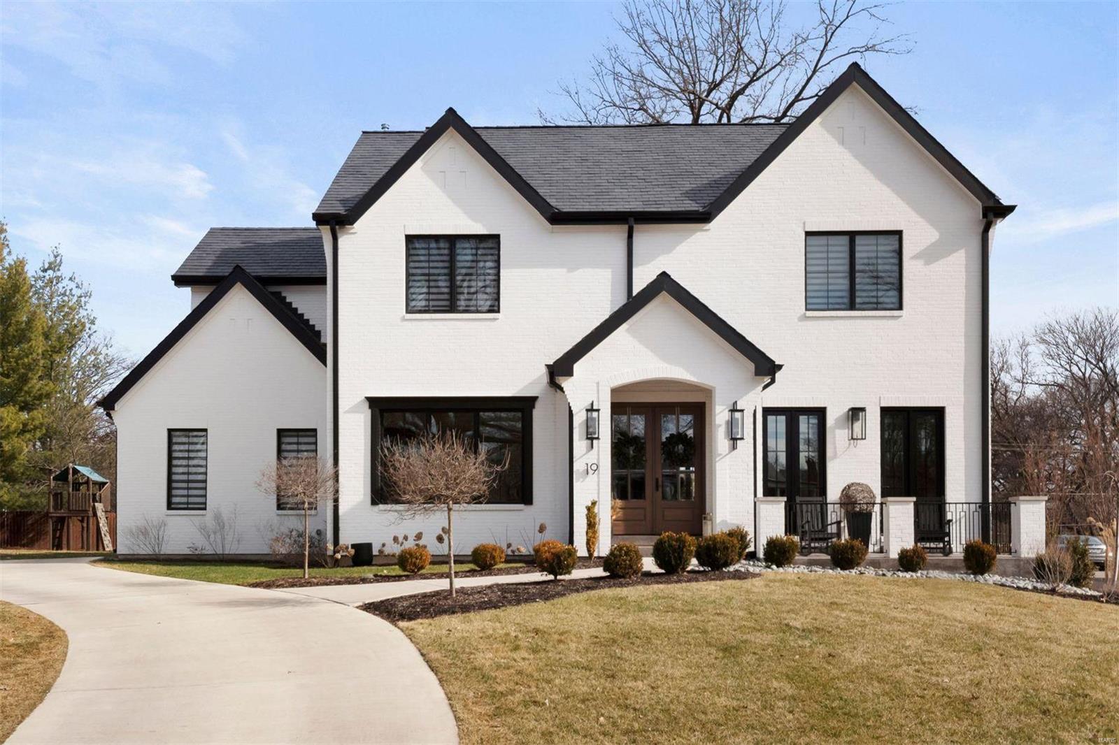 This exceptional 2.5 year old home is nestled in one of the most coveted neighborhoods of the Clayton School District, seamlessly blends modern elegance w/functional luxury.  The slate roof & brick façade create a stately first impression; inside, sophisticated designer finishes offer turnkey living at its finest. With over 5,000 feet of total living, the open main level includes a formal dining room, office w/wine cellar, mudroom, laundry & chef’s eat-in kitchen. A cozy hearth room that leads to a private outdoor oasis with an outdoor kitchen, fireplace, and low-maintenance turf. Upstairs, the primary suite is a retreat with a spa-inspired bath, custom walk-in closet, and more. The second floor has 3 additional bedrooms, 2 baths, and a bonus room. The finished lower level adds over 1,200 sq. ft. of living space with a family room, wet bar, 5th bedroom, and bath—perfect for entertaining. Oversize 2 car garage fit for lifts. Minutes from downtown Clayton’s shops and restaurants. Additional Rooms: Mud Room