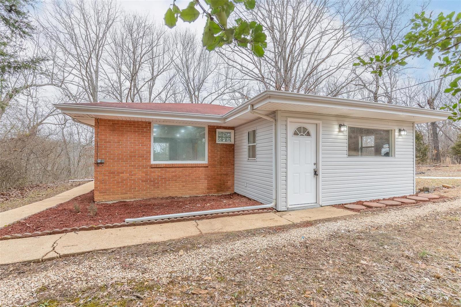 Check out this completely remodeled home in Doniphan on 1 acre! Sits conveniently right outside of town with 2 bedrooms and 1 bathroom plus an unfinished basement with plumbing and room for extra bedrooms! The home has brand new central heat and air with warranty along with new kitchen, bathroom, flooring, and paint. Large open living area with beautiful fireplace. Now listed at $125,000 call today for your showing!